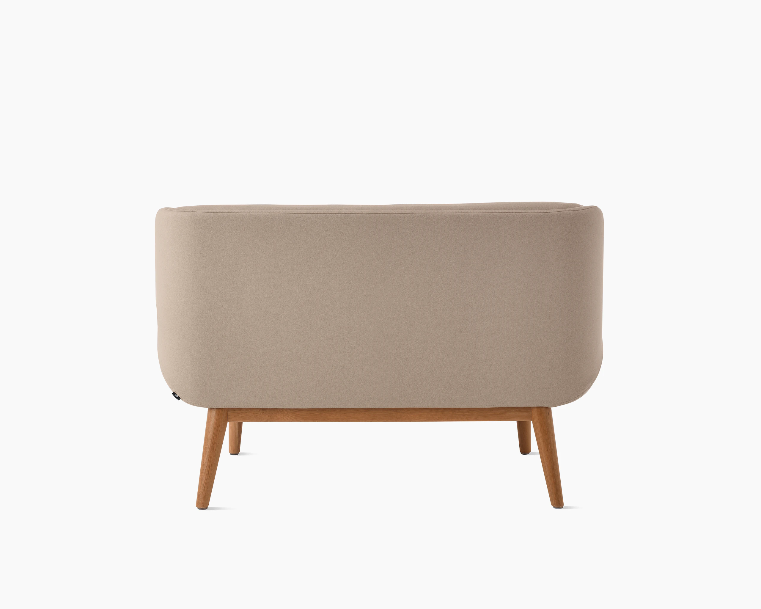 White background shot of Hush Sofa with taupe fabric and wooden base.