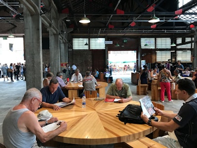 Groups of people in the multi-use space at SESC Pompeia Factory