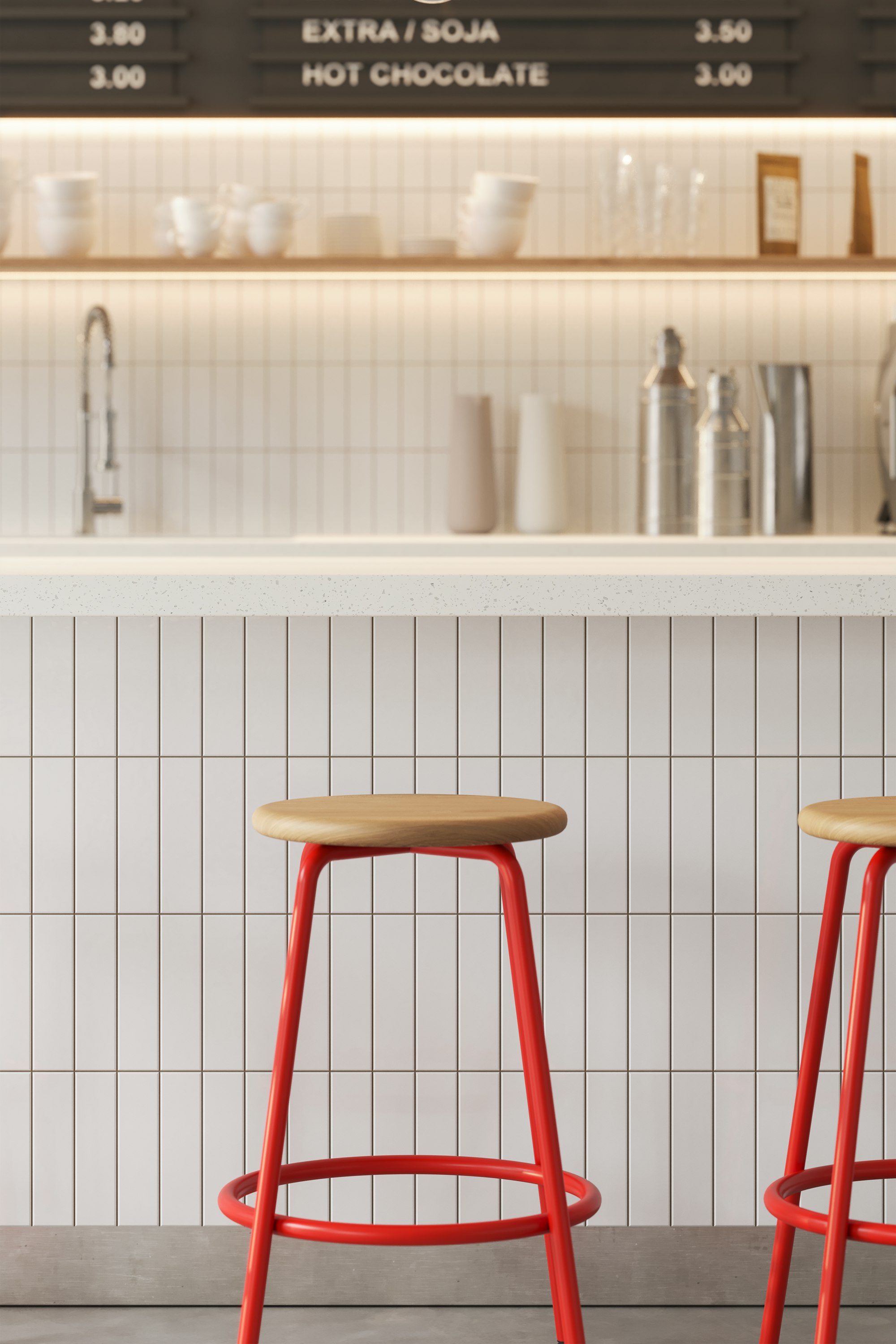 Counter-height Penny stool with powder-coated base in front of a bar.