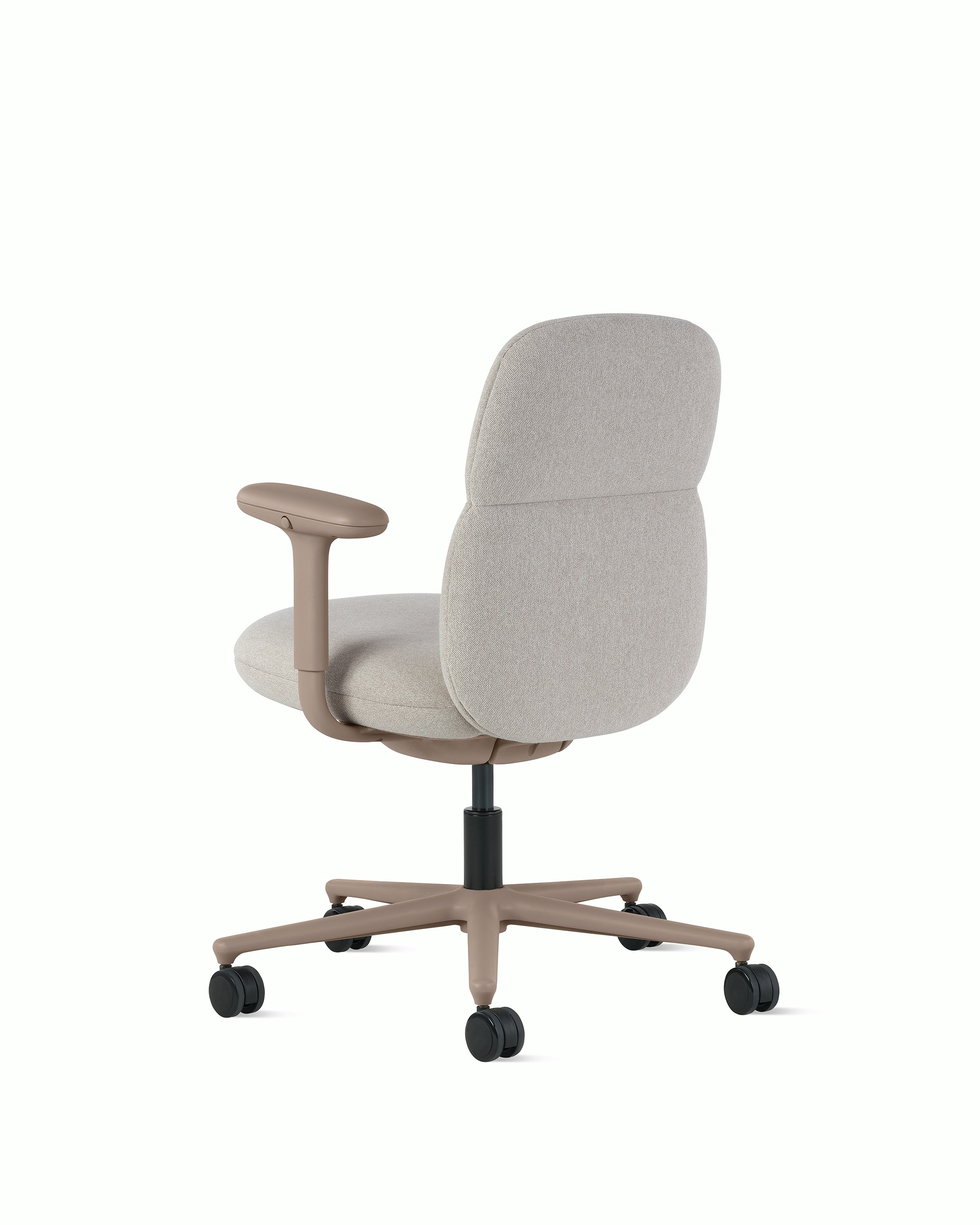 Rear angle view of a mid-back Asari chair by Herman Miller in light brown with height adjustable arms.