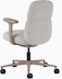 Rear angle view of a mid-back Asari chair by Herman Miller in light brown with height adjustable arms.