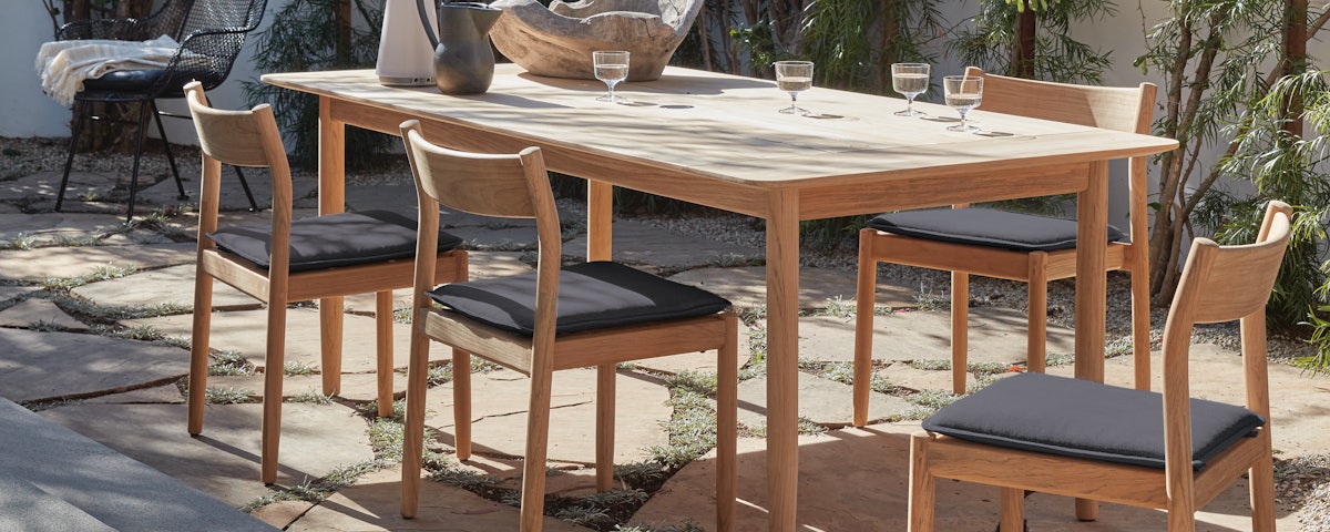 Terassi Side Chairs and Terassi Dining Table in an outdoor patio setting