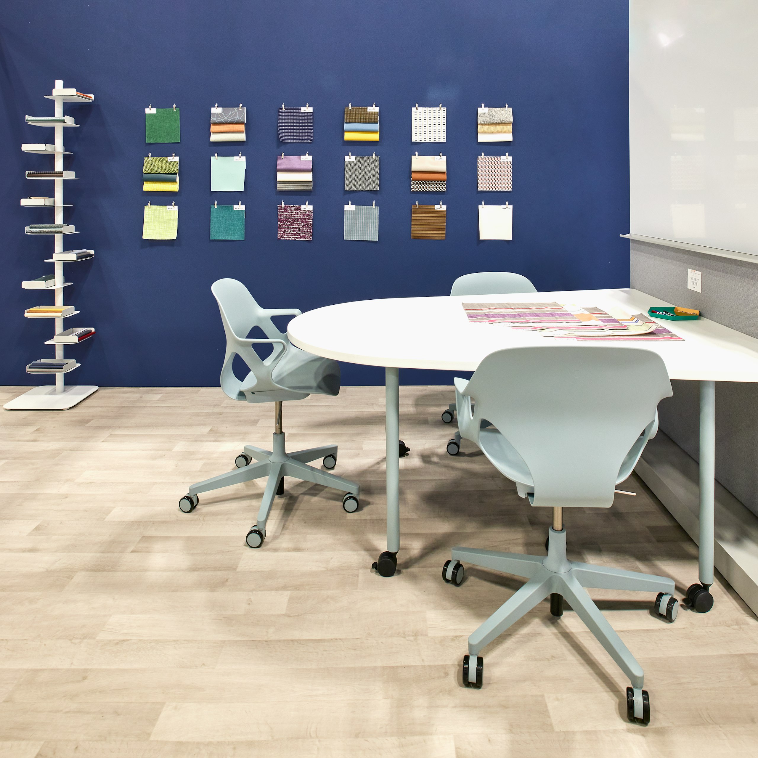 Healthcare exhibit showing a team work area and a display of performance materials appropriate for healthcare.