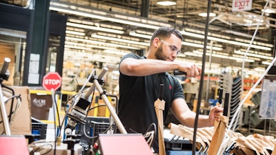An associate working in a manufacturing plant.
