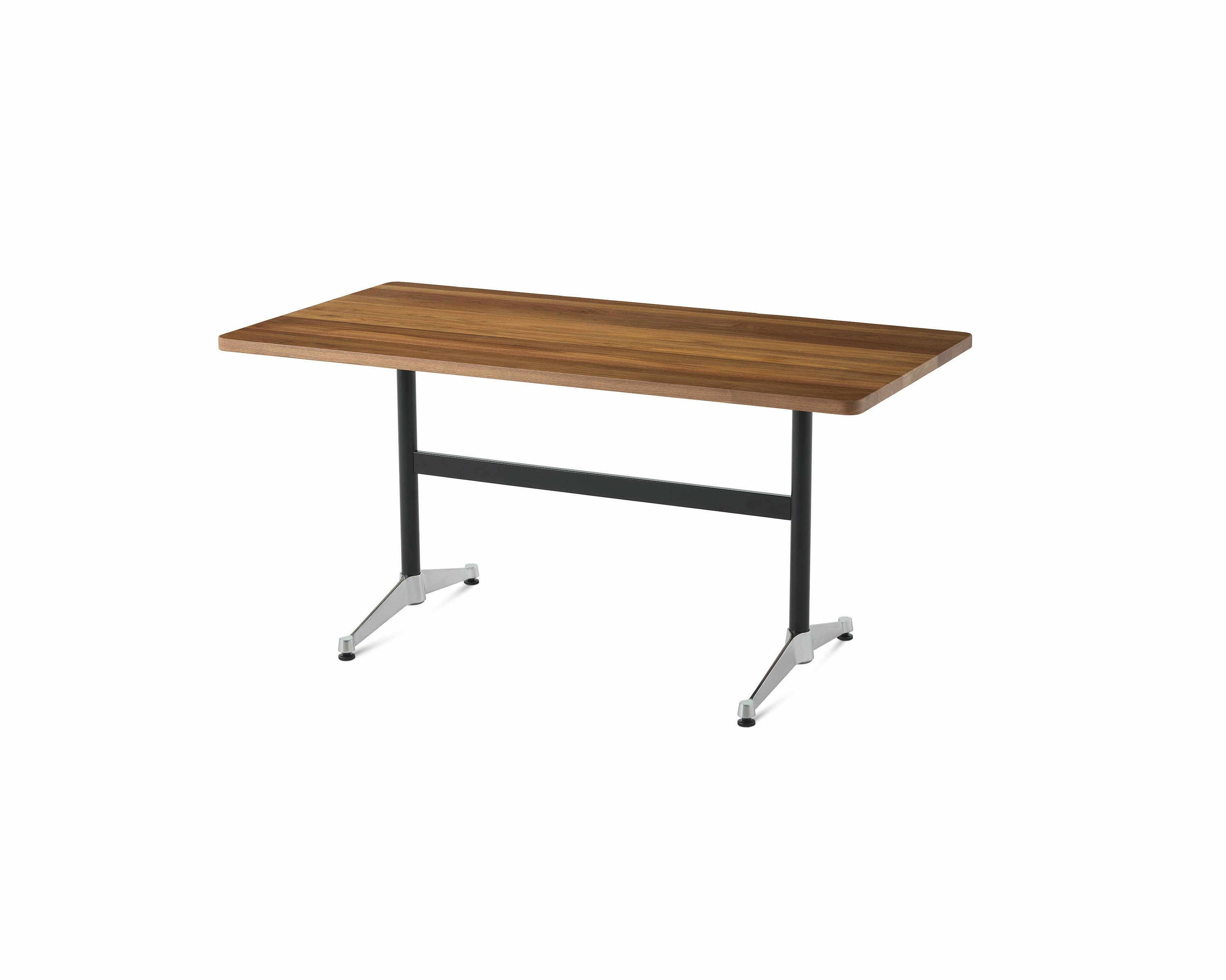 An Eames T-Leg table with a walnut top, black legs, and chrome feet. 