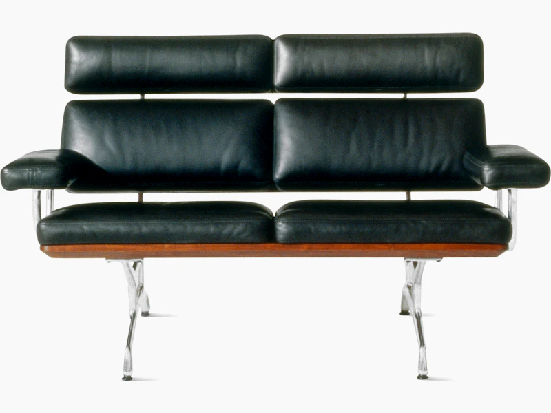 A two-seat Eames Sofa, viewed from the front.