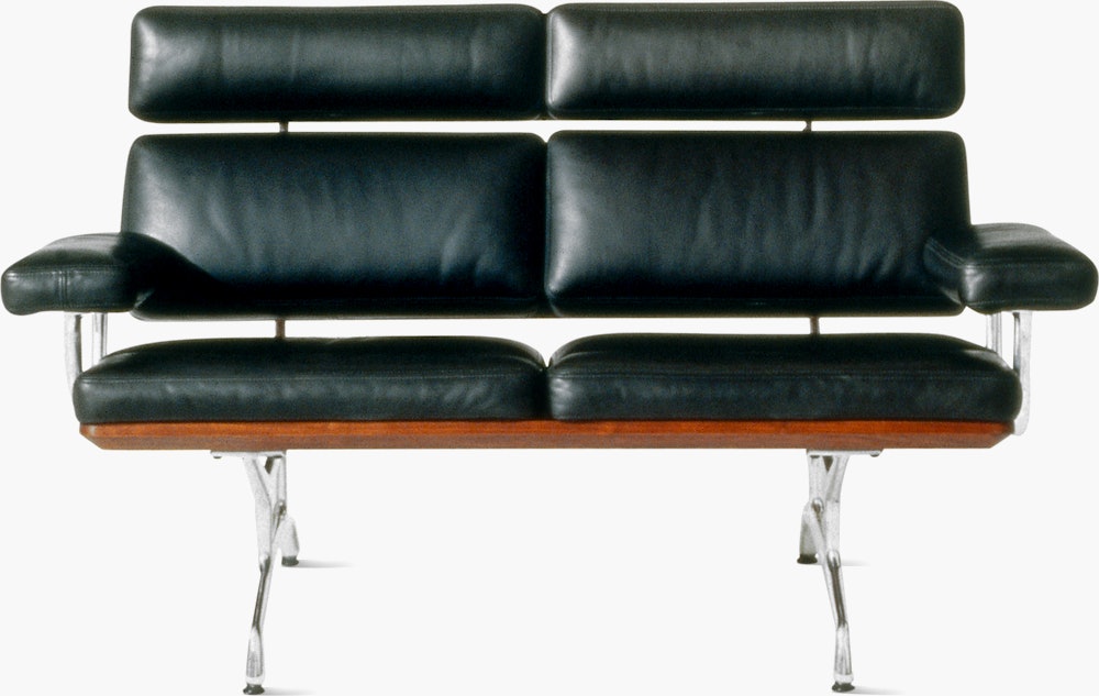 A two-seat Eames Sofa, viewed from the front.