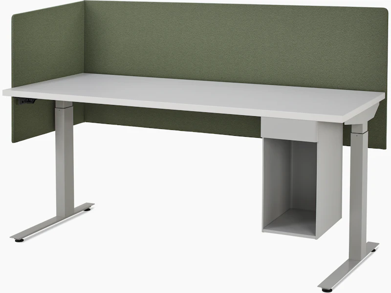 Large, grey metal suspended storage attached to bottom of laminate worksurface of height adjustable table with two sided olive fabric screen.