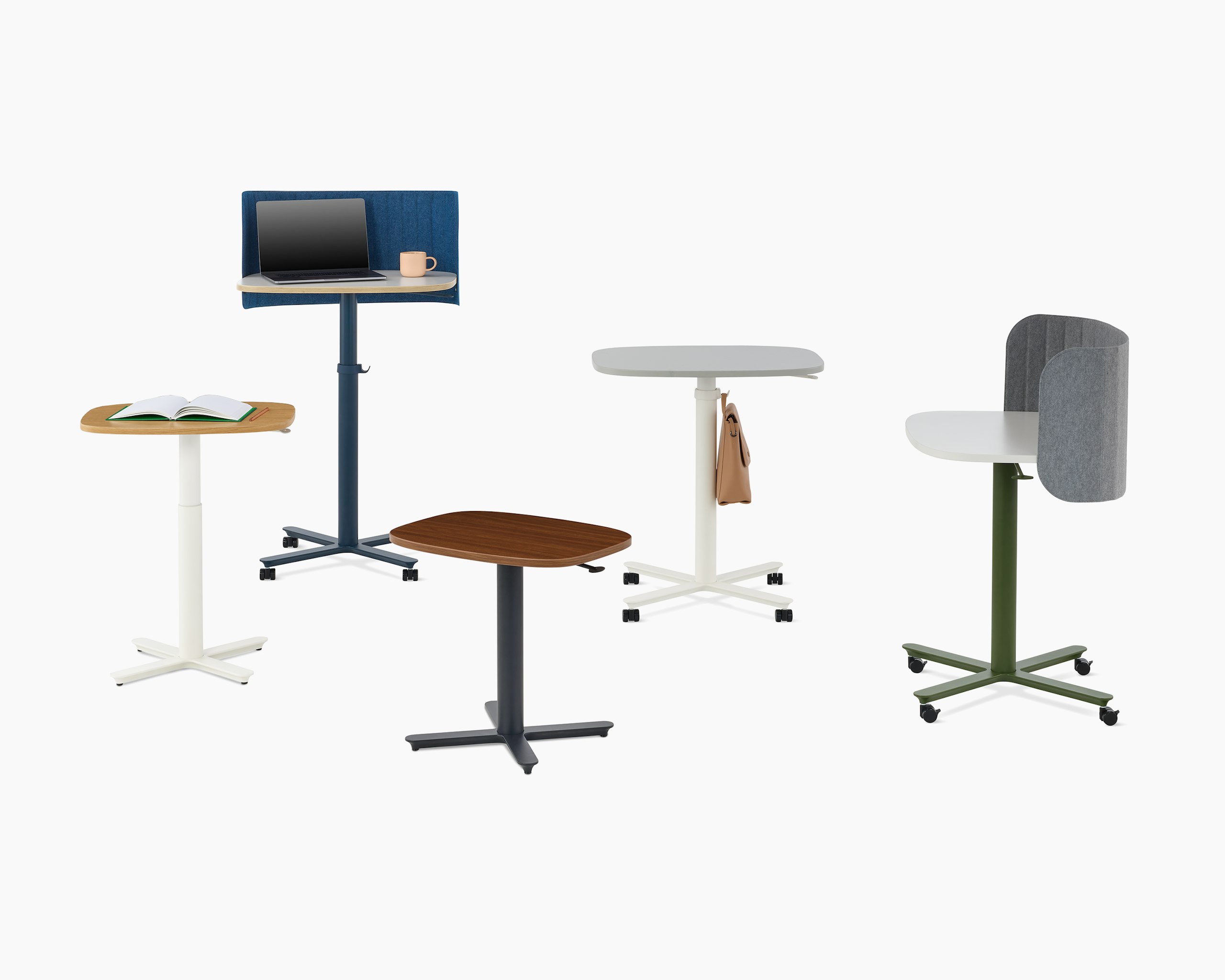 Multiple Passport Work Tables in both small and large size with a variety of base finishes, mix of solid and woodgrain tops, and accessories.