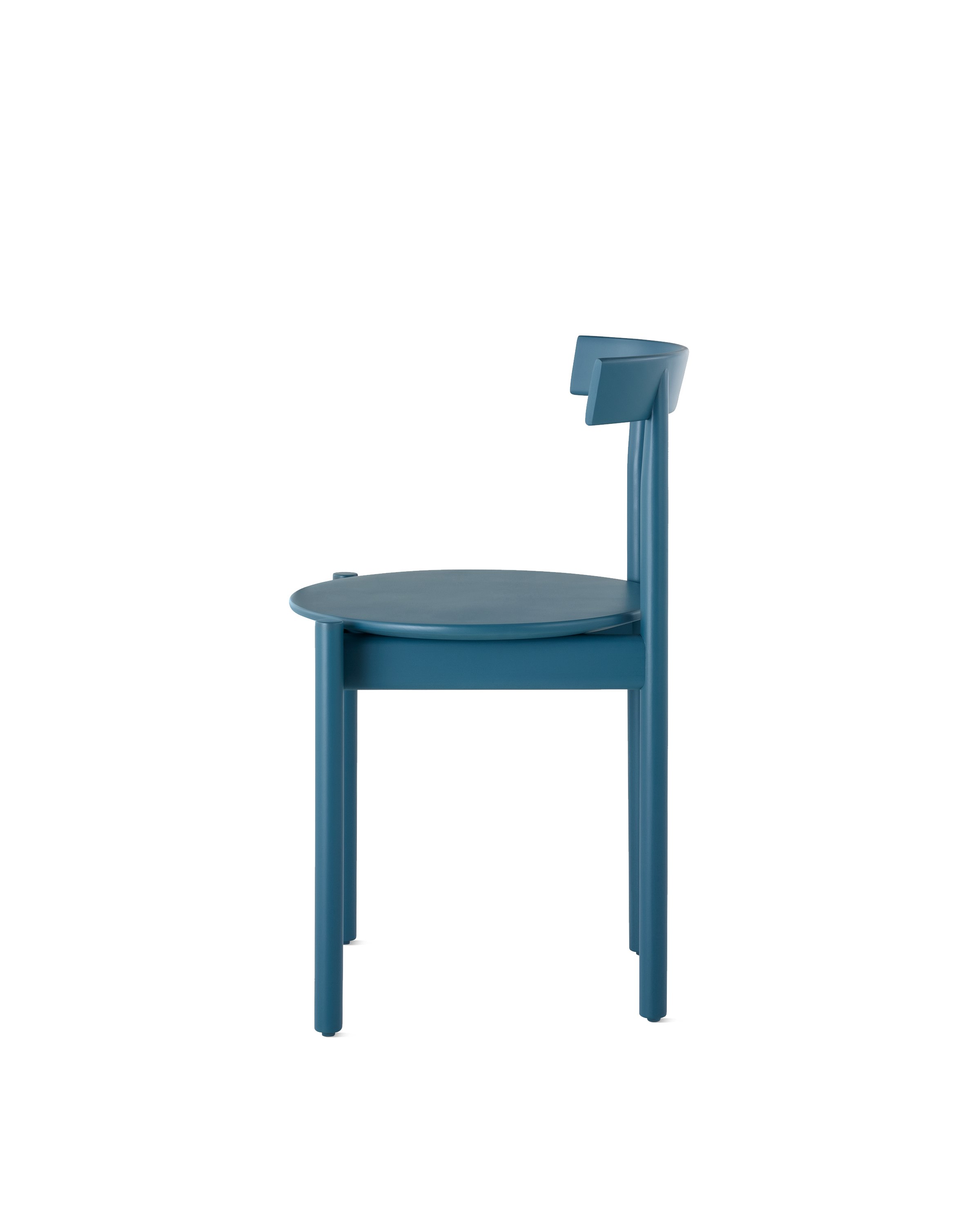 Profile view of a blue Comma Chair.