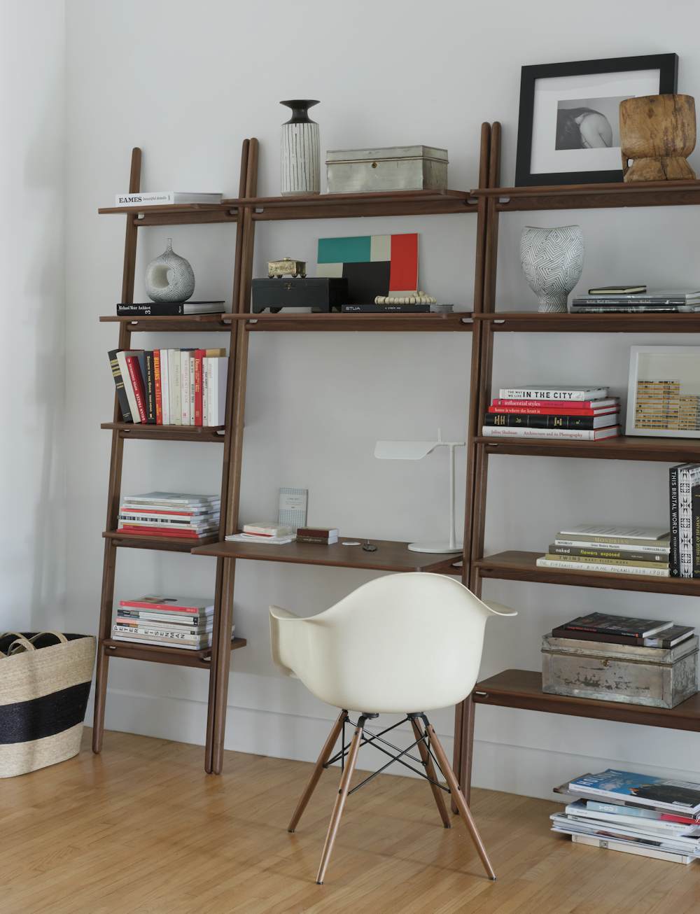 Fold Ladder Shelving and Eames Molded Plastic Armchair in a home office setting