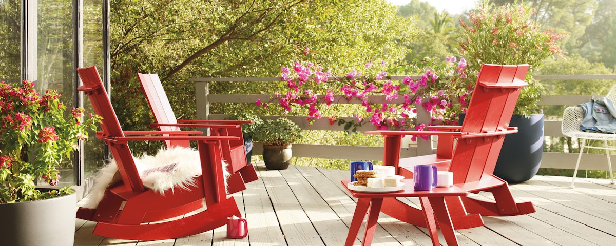 Loll Adirondack Rocking Chairs and Side Table in outdoor deck scene