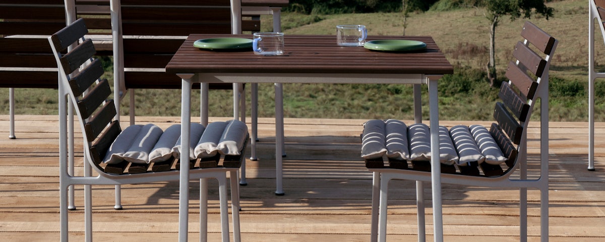 Traverse Cafe Table and Traverse Side Chairs in an outdoor deck setting
