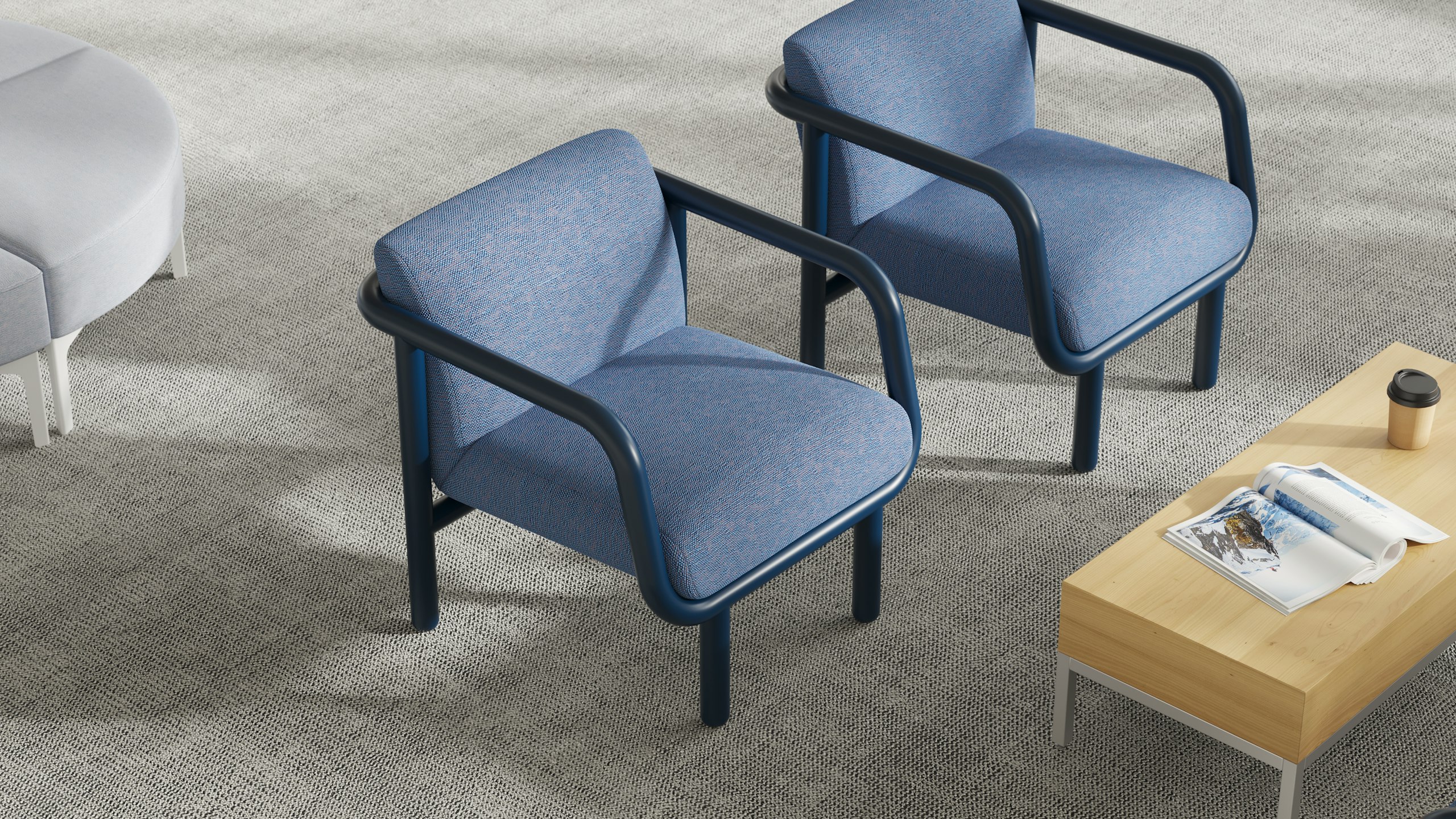 A detail of two Percy chairs in a waiting area.