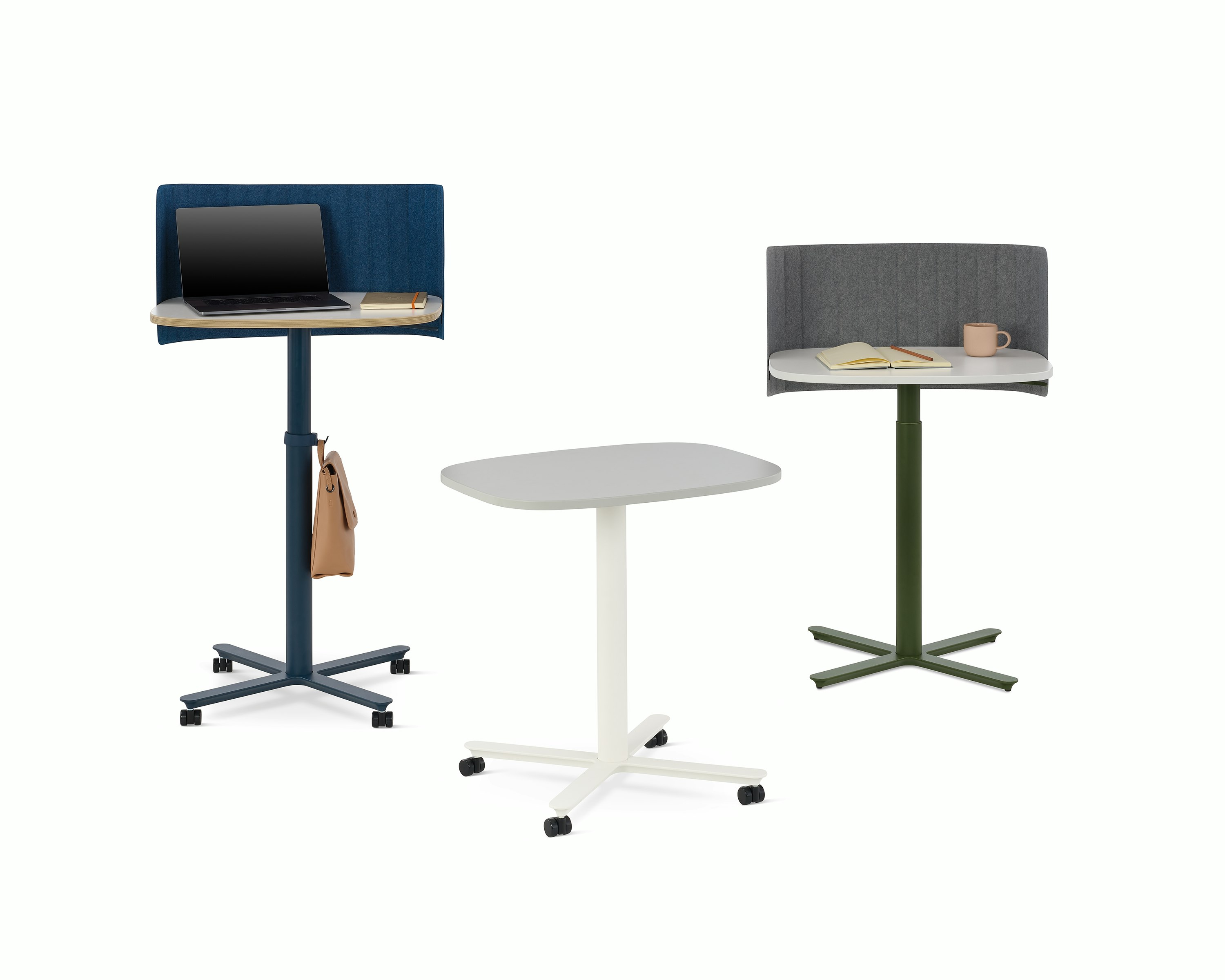 Multiple large Passport Work Tables shown with white and light grey tops and a variety of base colors and accessories.