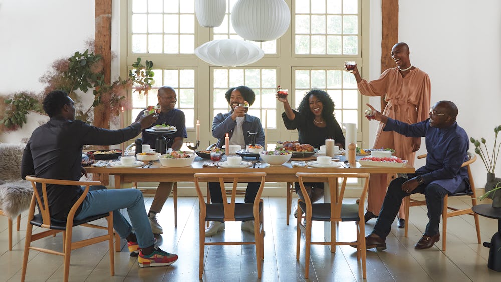 Chid Liberty and Georgie Badiel hosting dinner at Gather Table with Wishbone Chairs