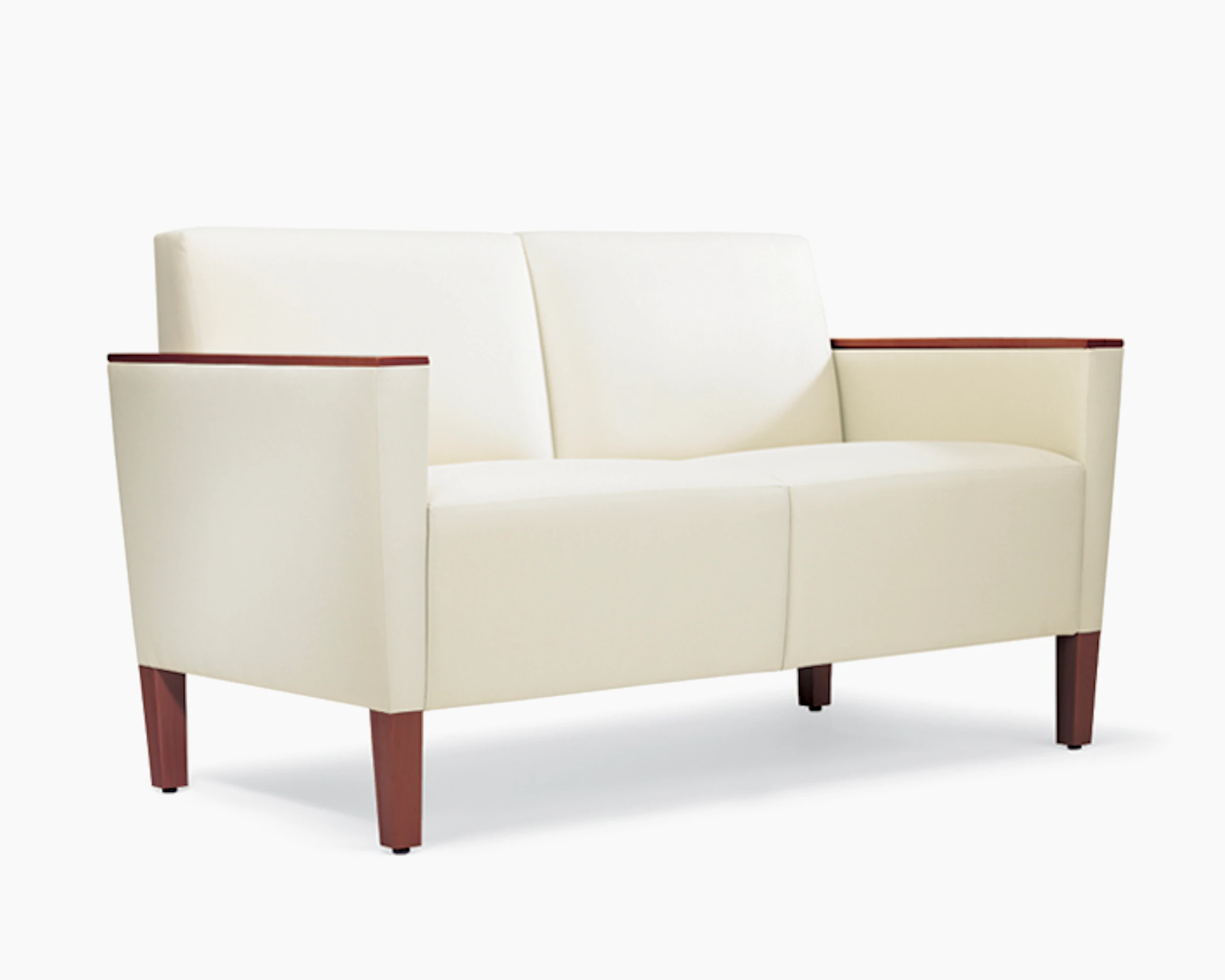 A three-quarter view of a Brava Classic Lounge Settee with white textile and wood arm caps.