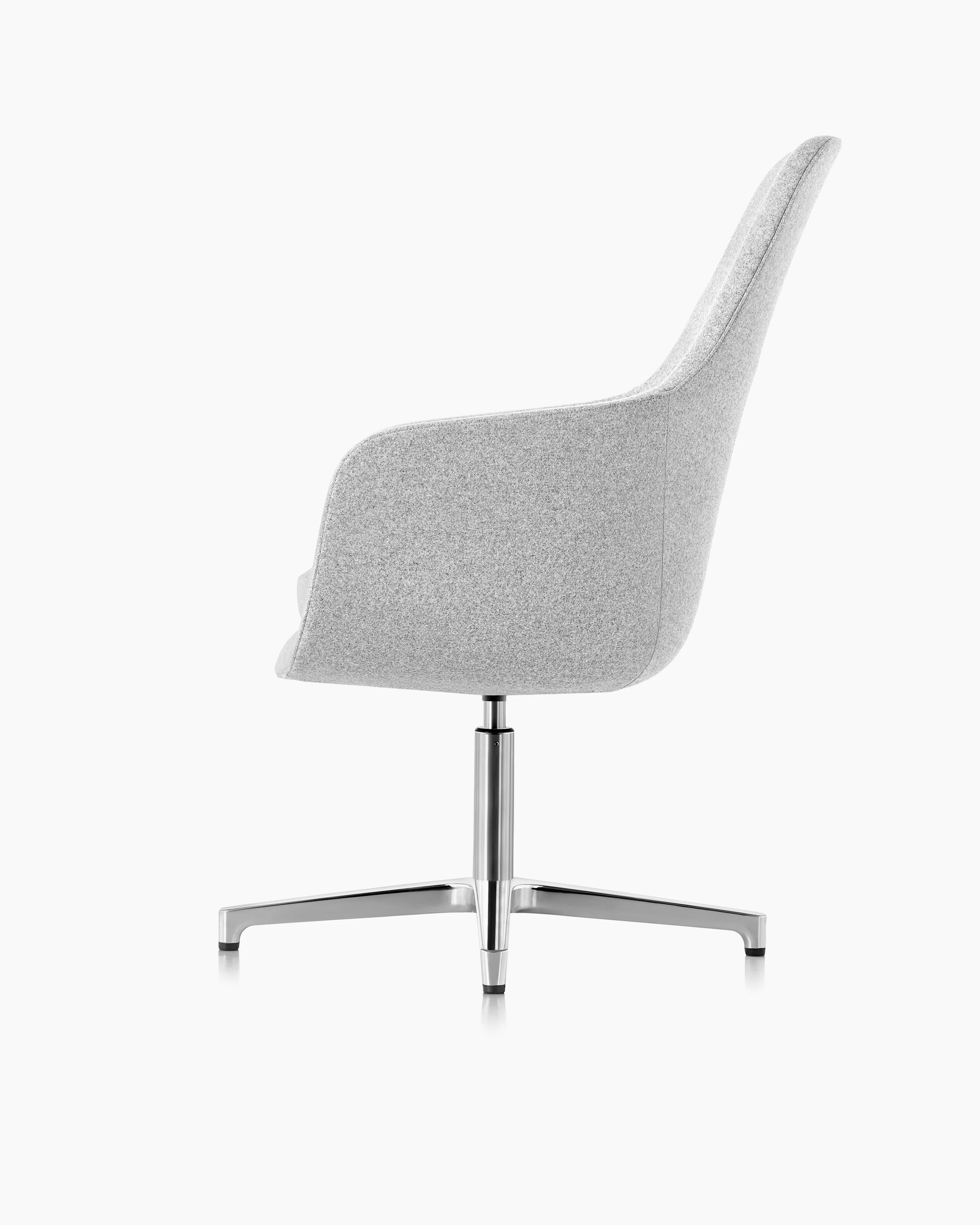 Side view of a high-back Saiba Chair with light gray upholstery.