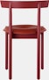 A red Comma Chair with a seat pad, viewed from the back.