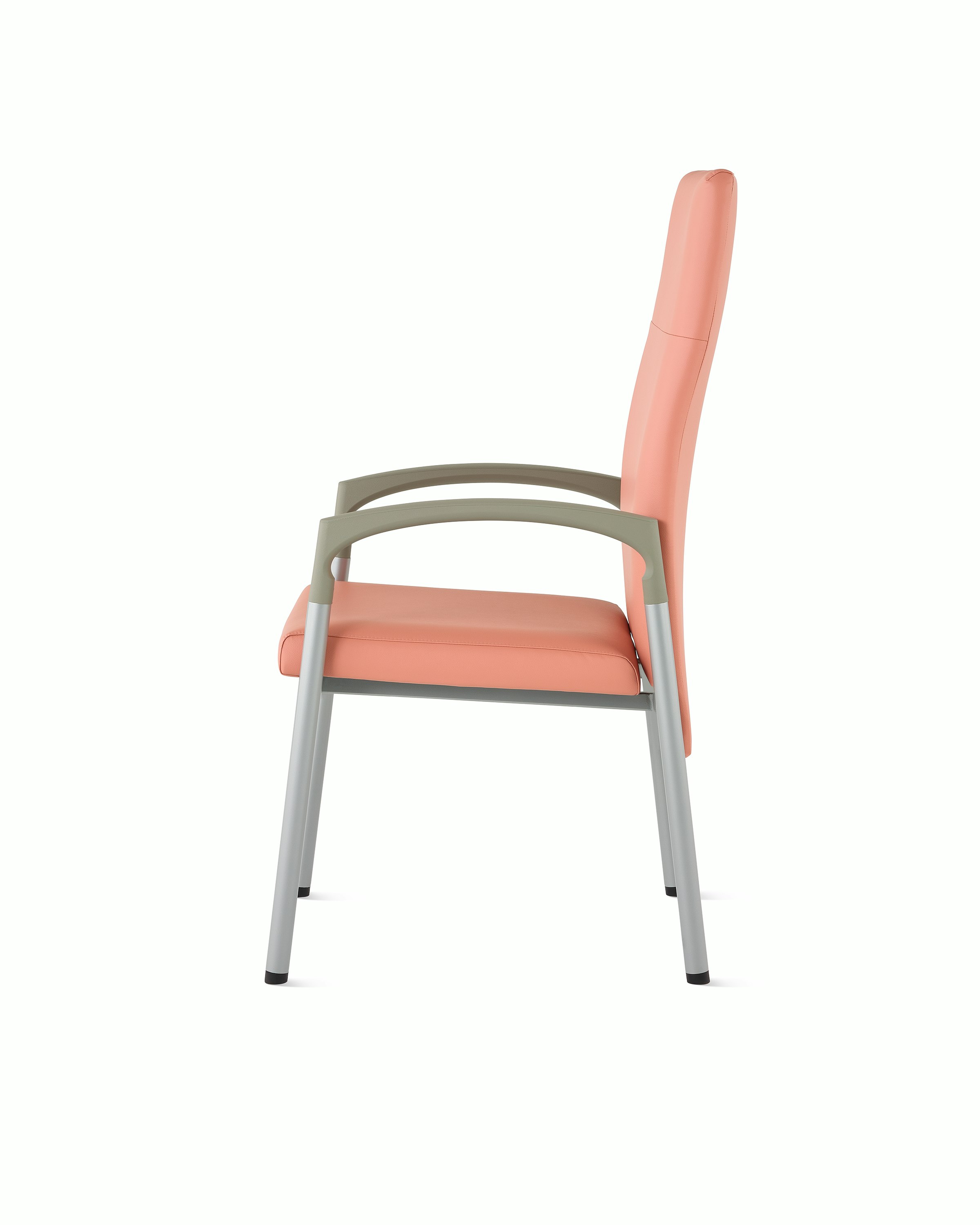 Side view of a high-back Valor patient chair in a salmon upholstery and silver frame with pewter armcaps.