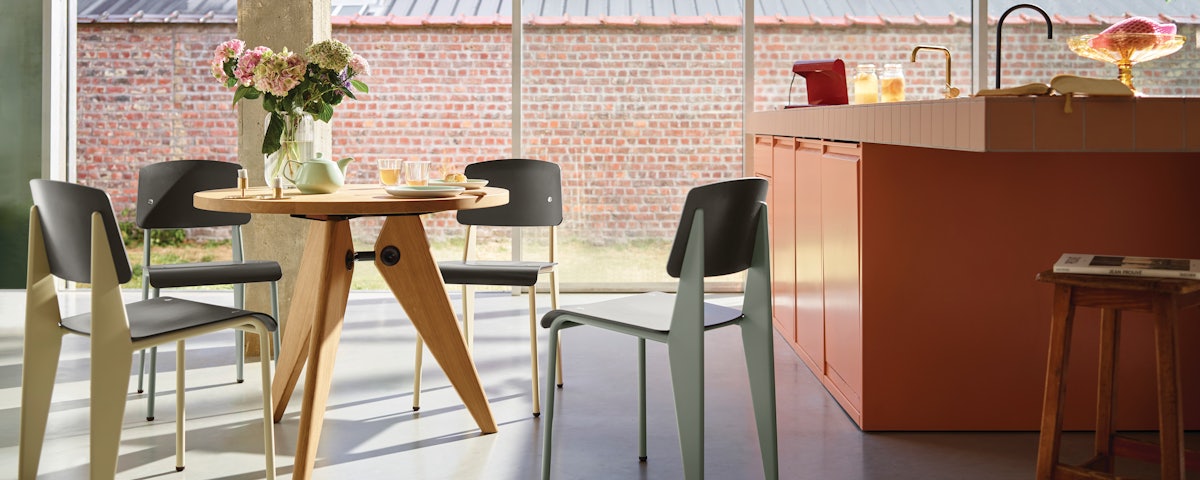 Prouve Standard Chairs and Gueridon Table in a home dining room setting