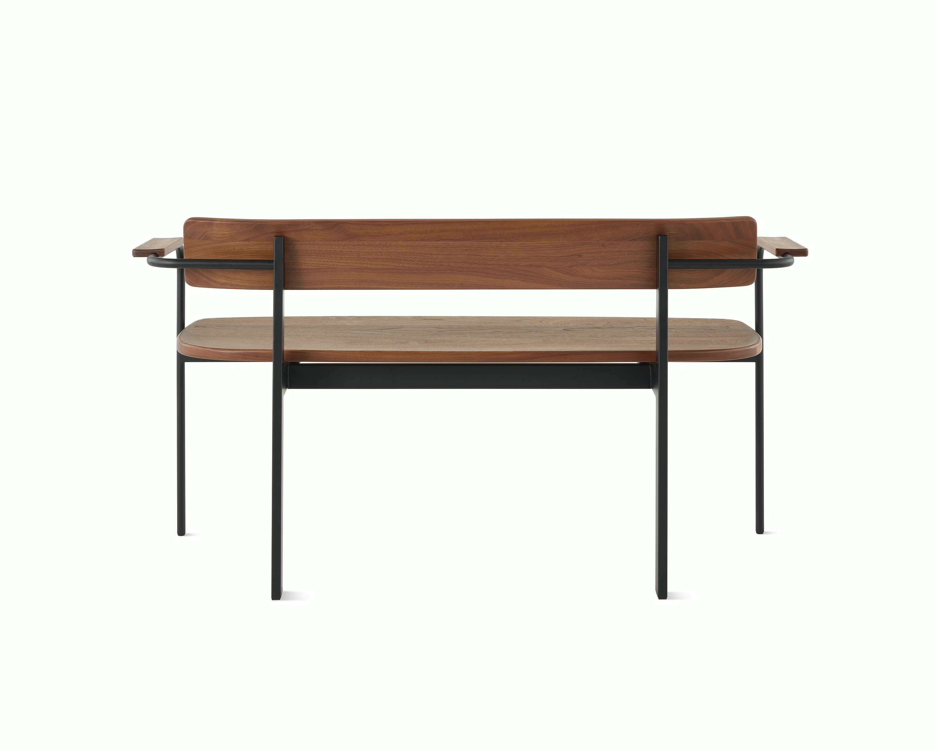 A Betwixt Bench with walnut seat, backrest, and arms with a black frame.