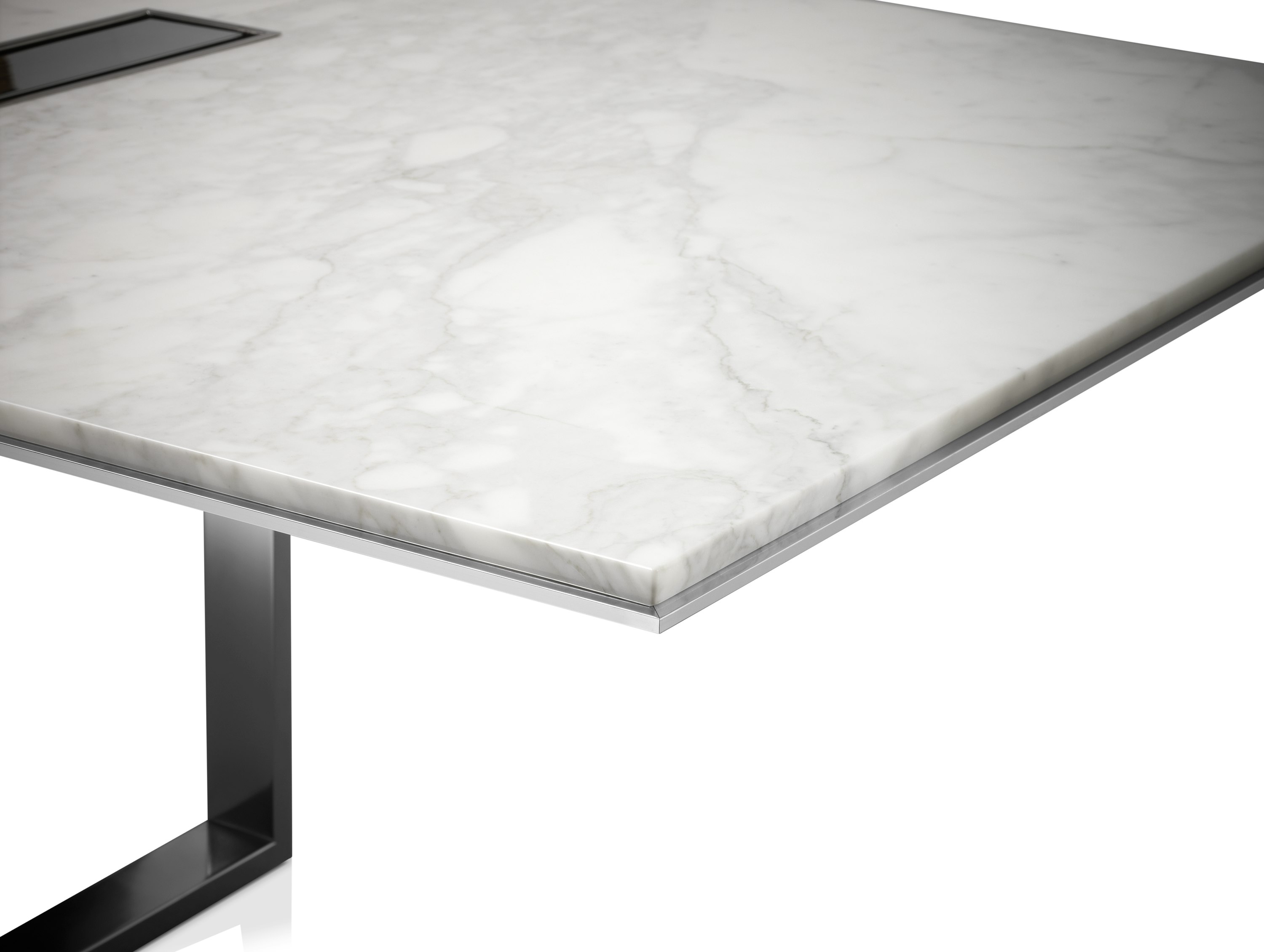 Highline Conference Table with White Carrara top, Polished Chrome base, Metal Edge detail, tabletop power, corner detail view.