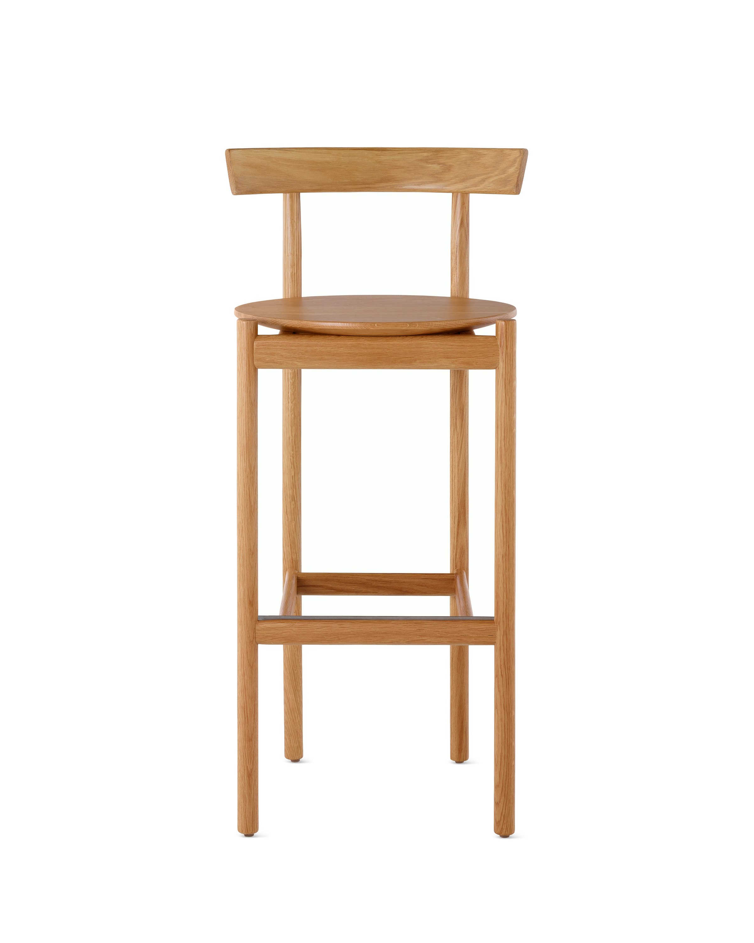 An oak bar-height Comma Stool, viewed from the front.