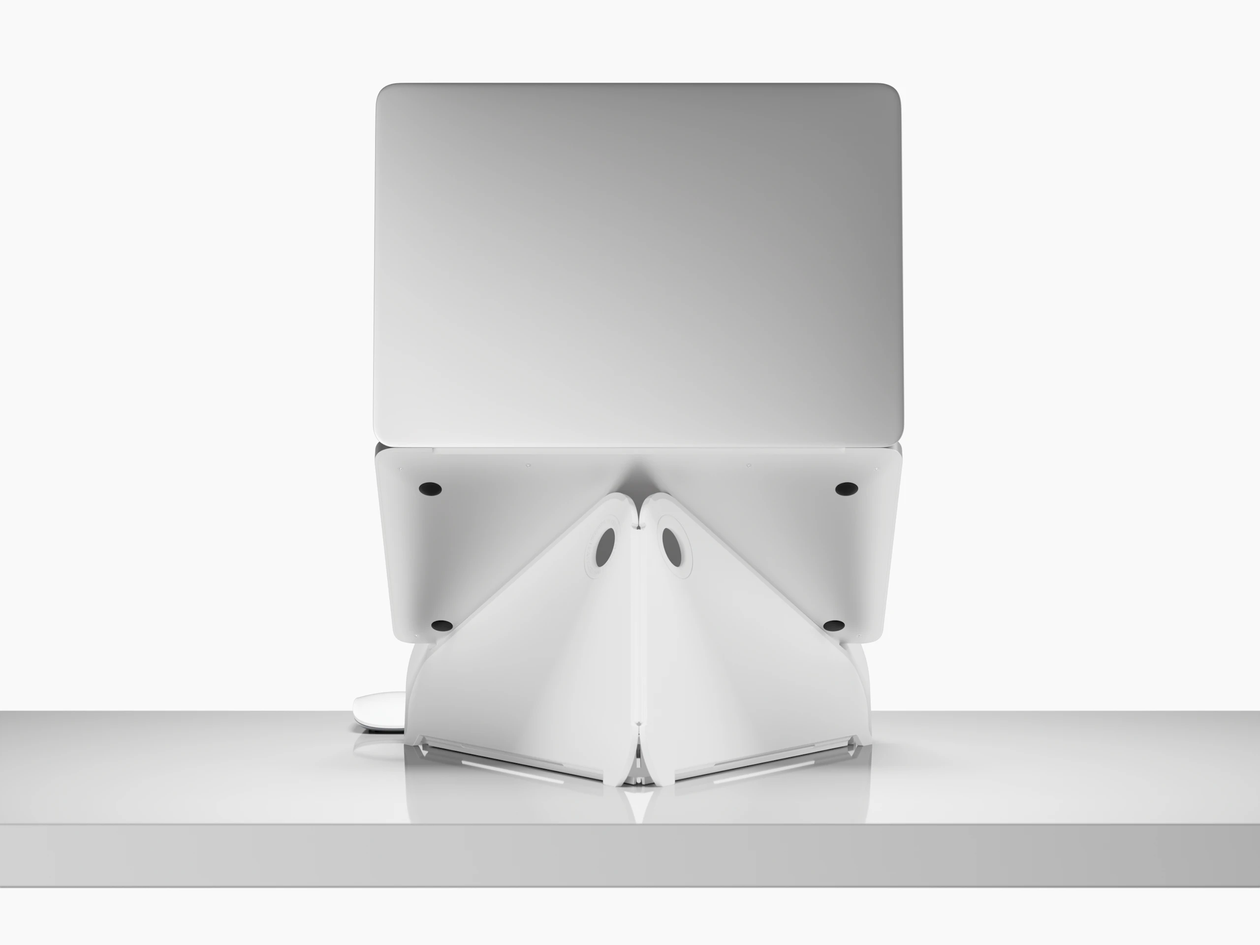 Back view of an open laptop raised to eye level on an Oriupra Laptop Stand.