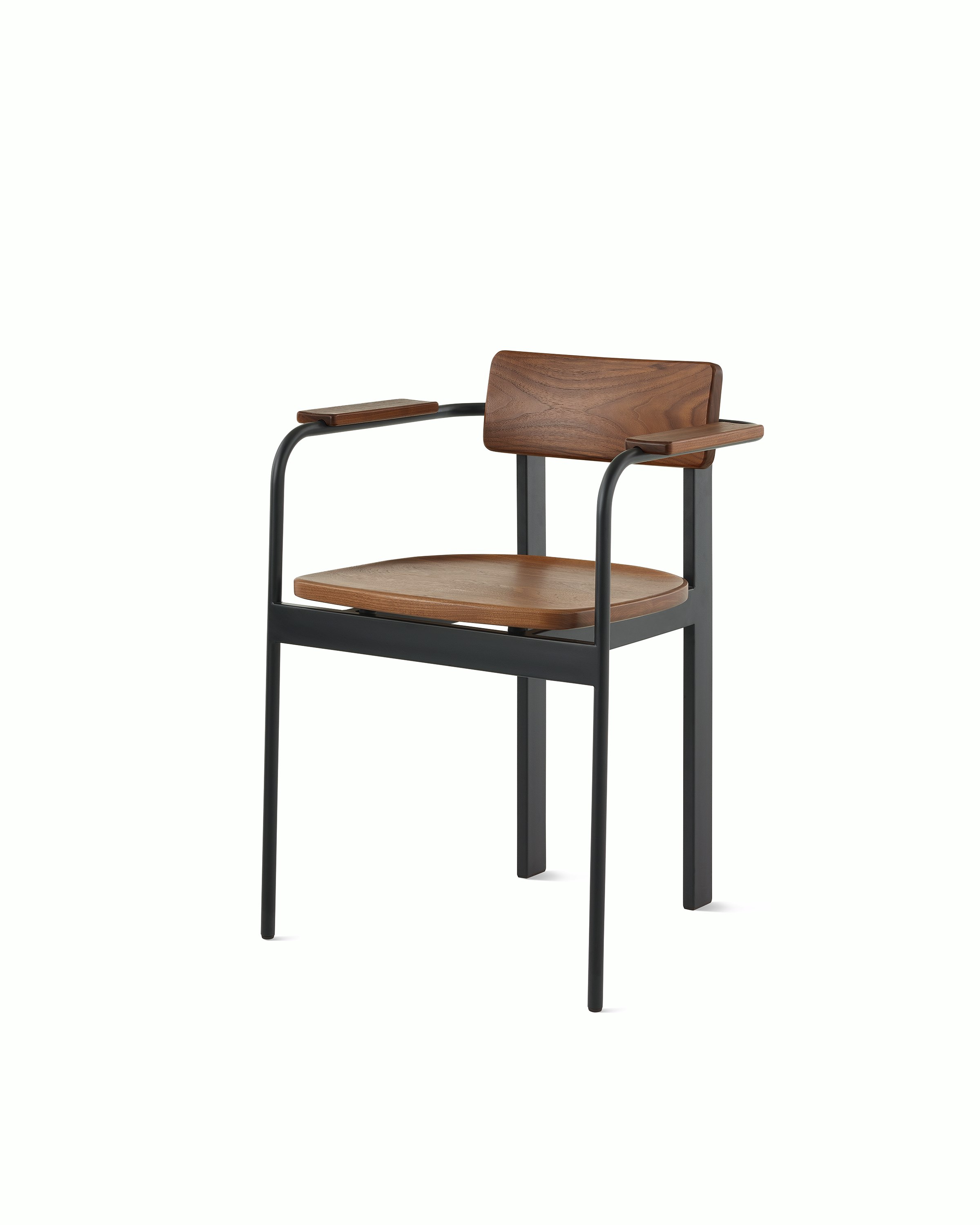 A Betwixt Chair with a walnut backrest, seat, and arms with a black frame.