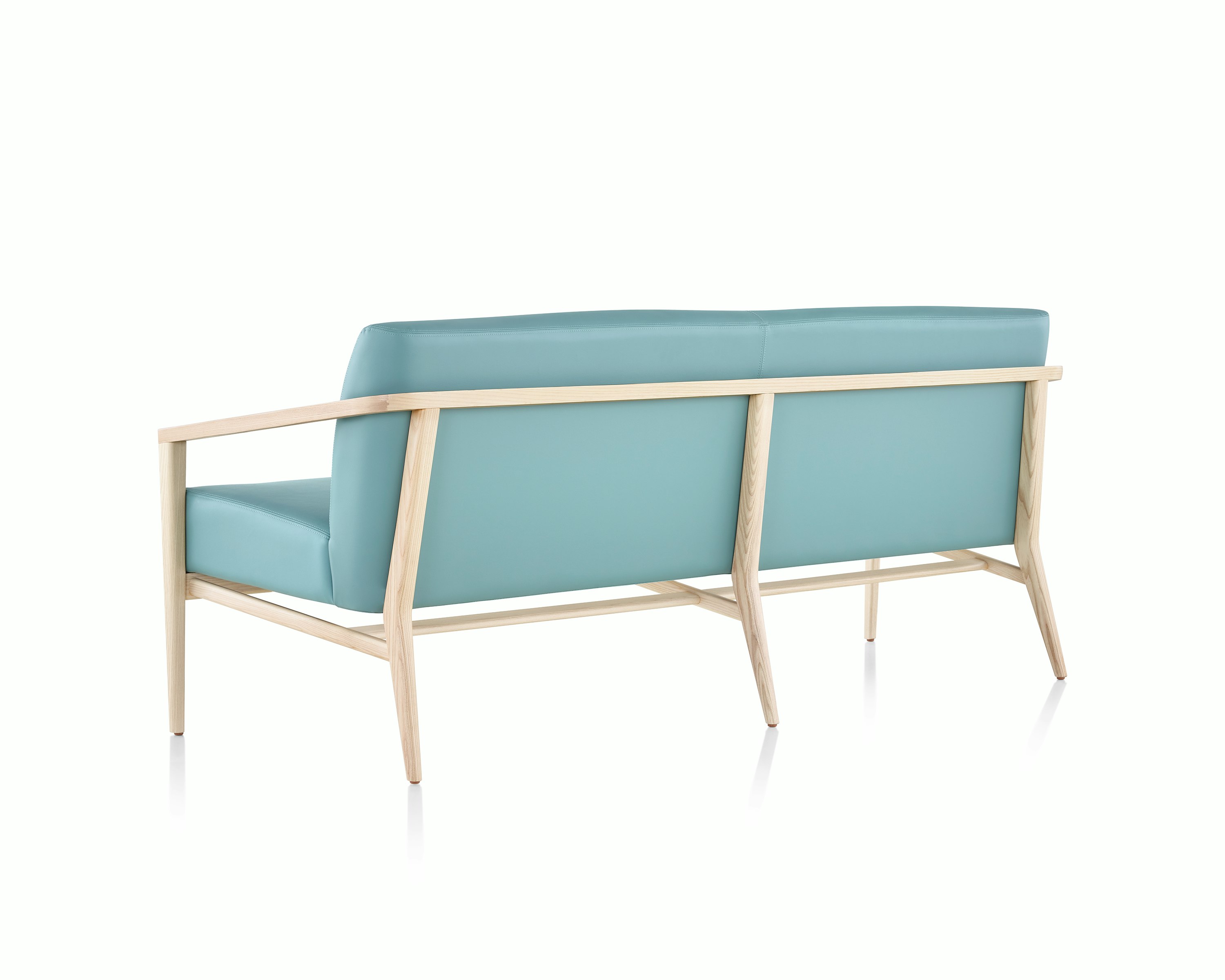 Rear three-quarter view of Palisade Lounge Seating 3 seat sofa on white sweep.