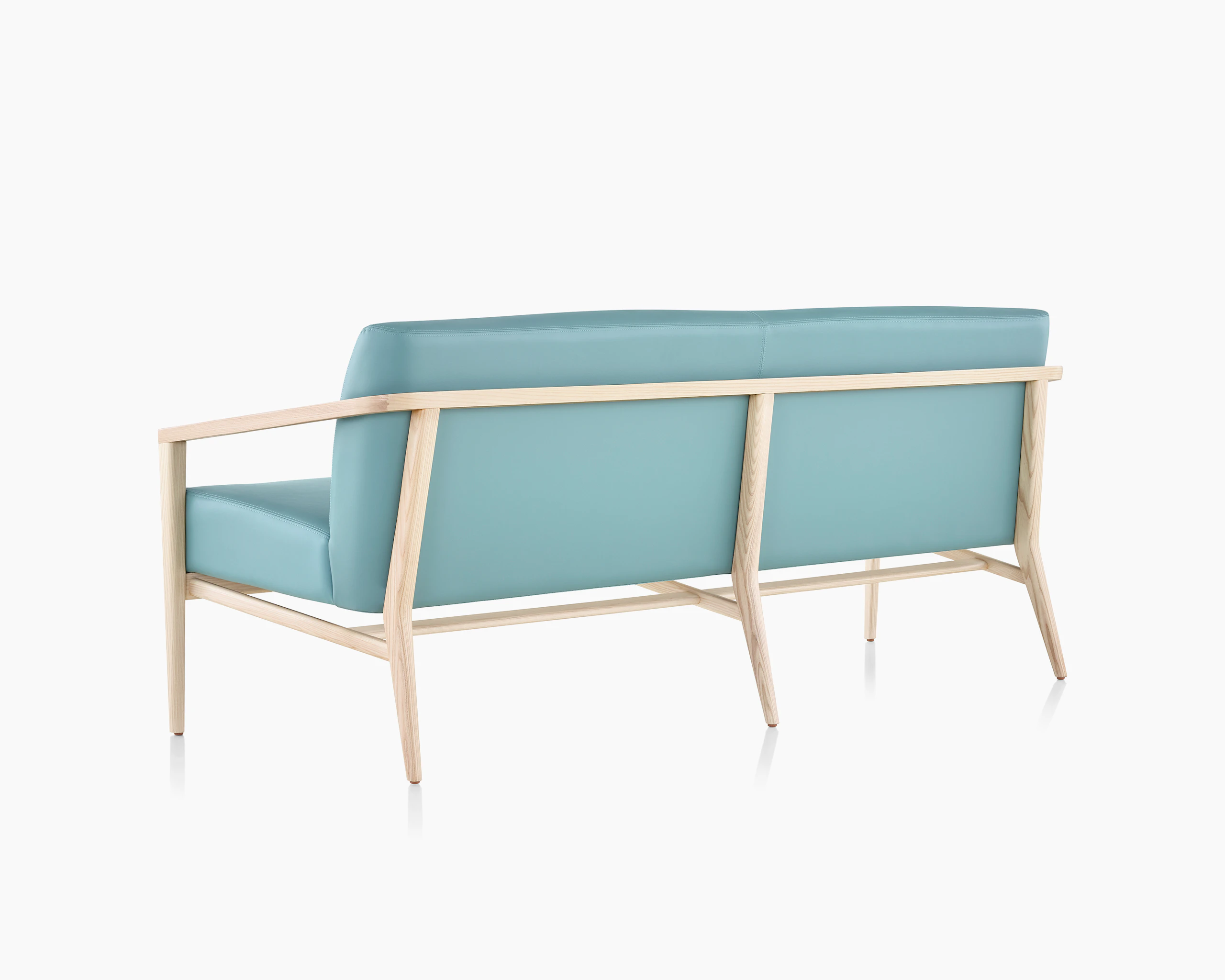 Rear three-quarter view of Palisade Lounge Seating 3 seat sofa on white sweep.