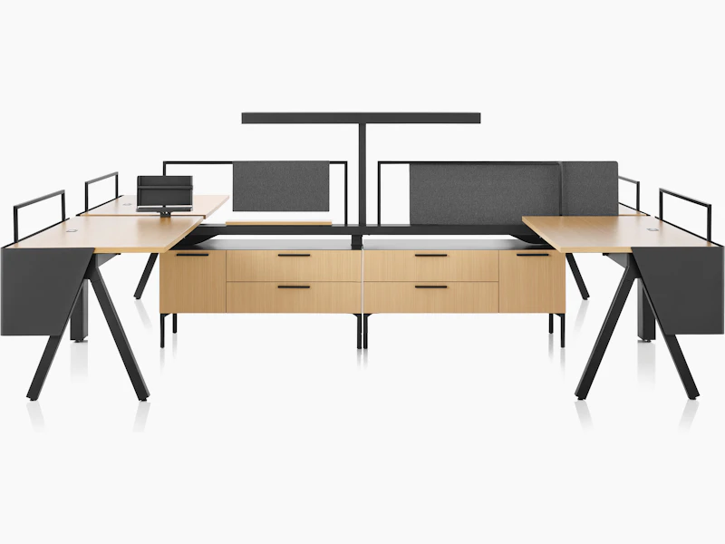 Brown and black Canvas Vista workstations with a-shaped legs, modesty screens and t-shaped light.