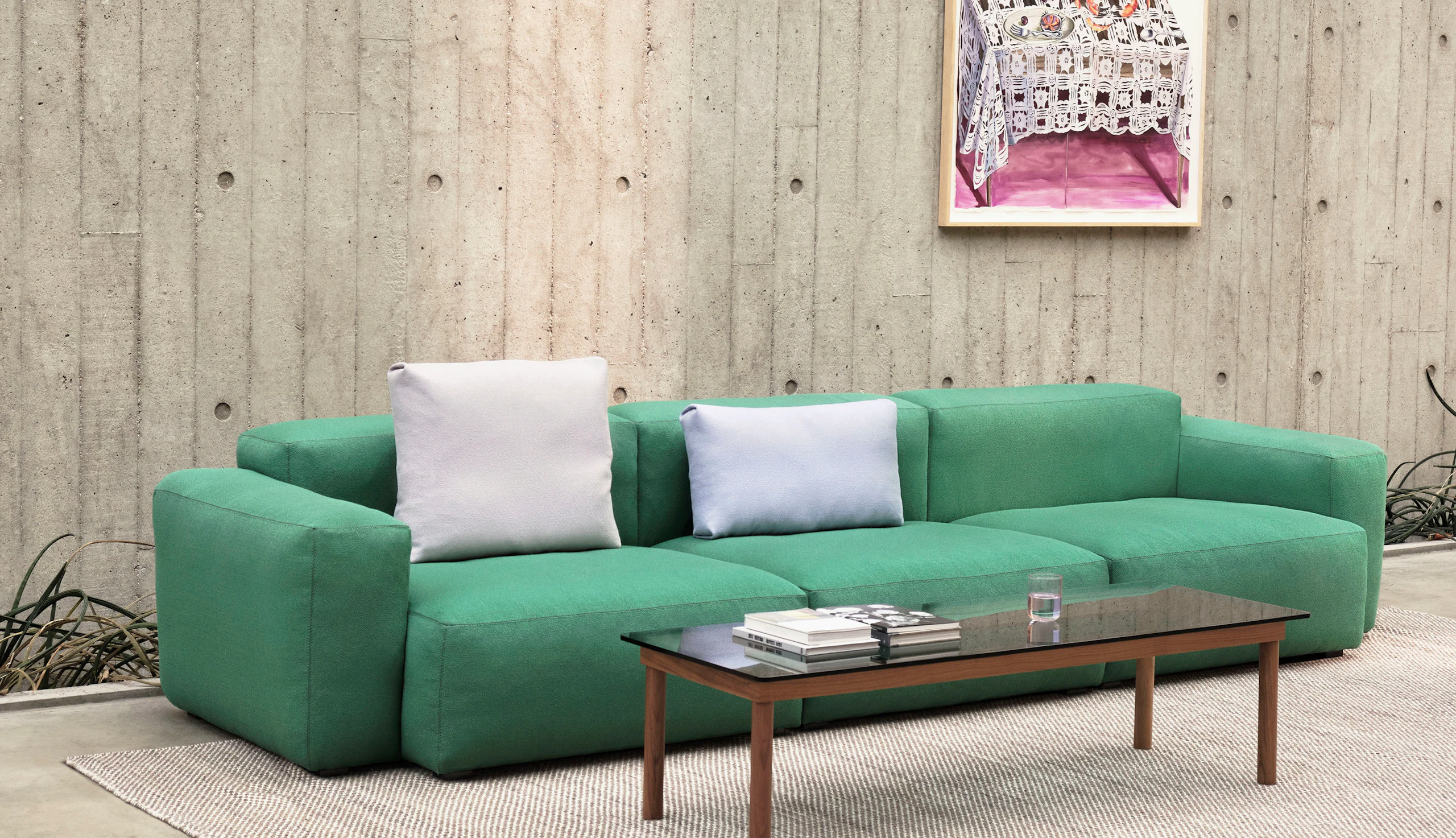 A Kofi Coffee Table positioned next to a Mags Soft Sectional Sofa.