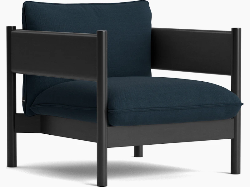 Arbour Club Armchair with black base and dark blue upholstery viewed from an angle