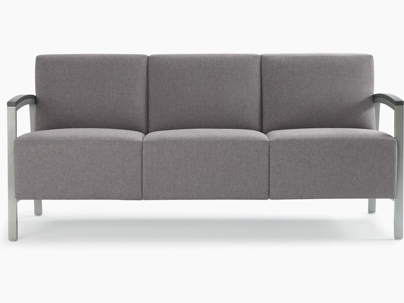 Front view of a gray Brava Modern Lounge Seating three-seat chair with wood arm caps.