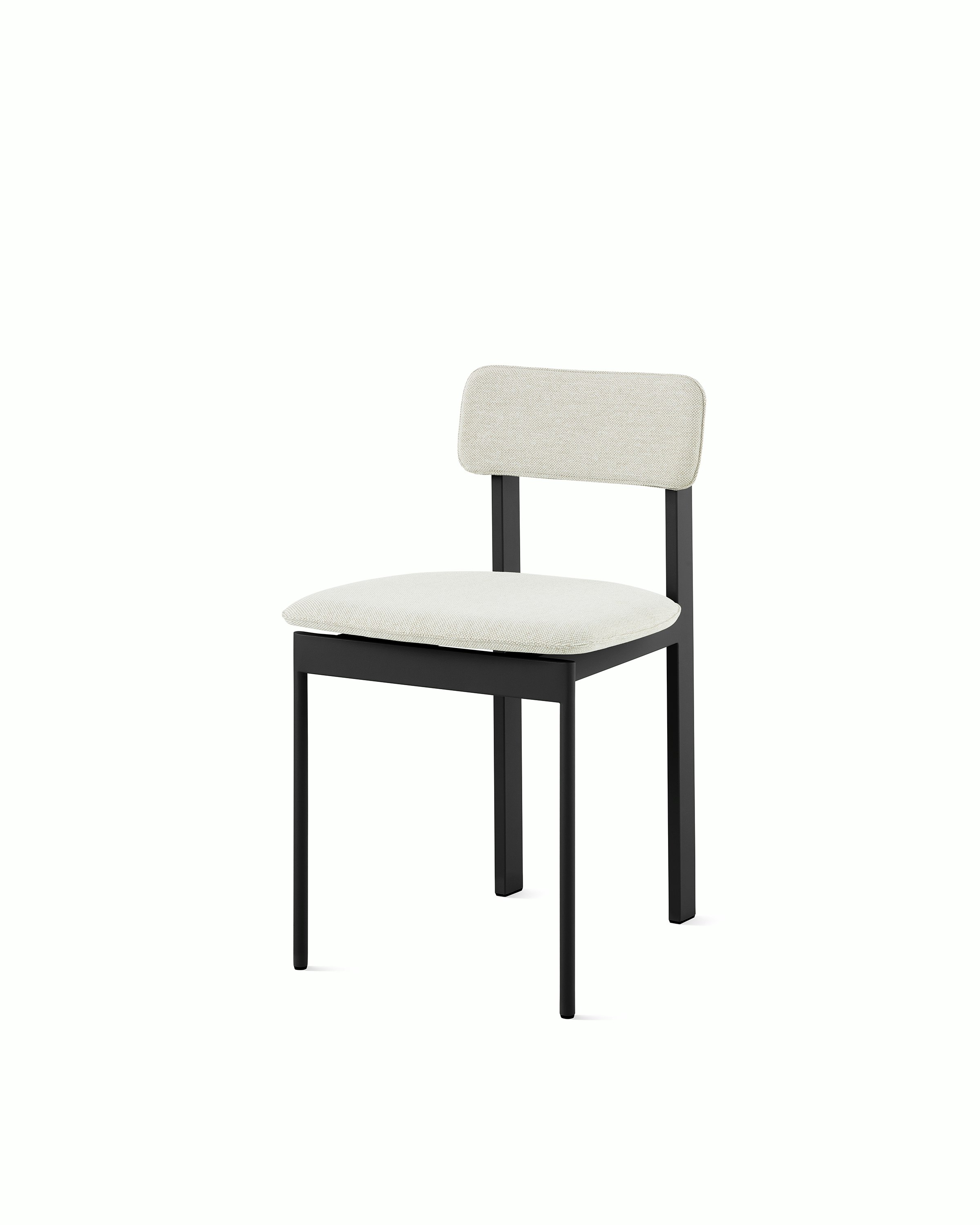A Betwixt Chair with light grey fabric and a black frame.