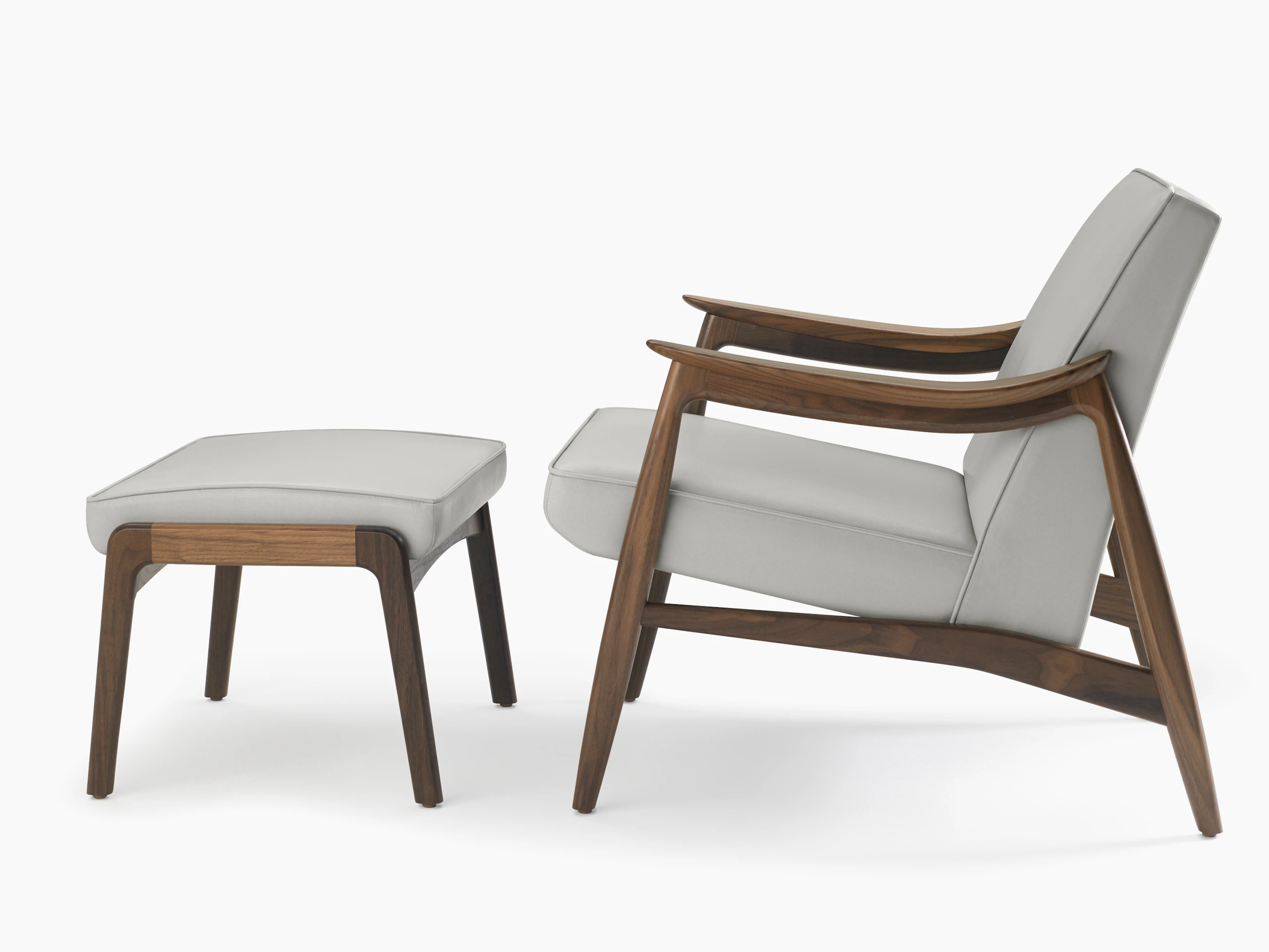 An Aspen Lounge Chair and Ottoman in a gray textile with walnut base and arms.