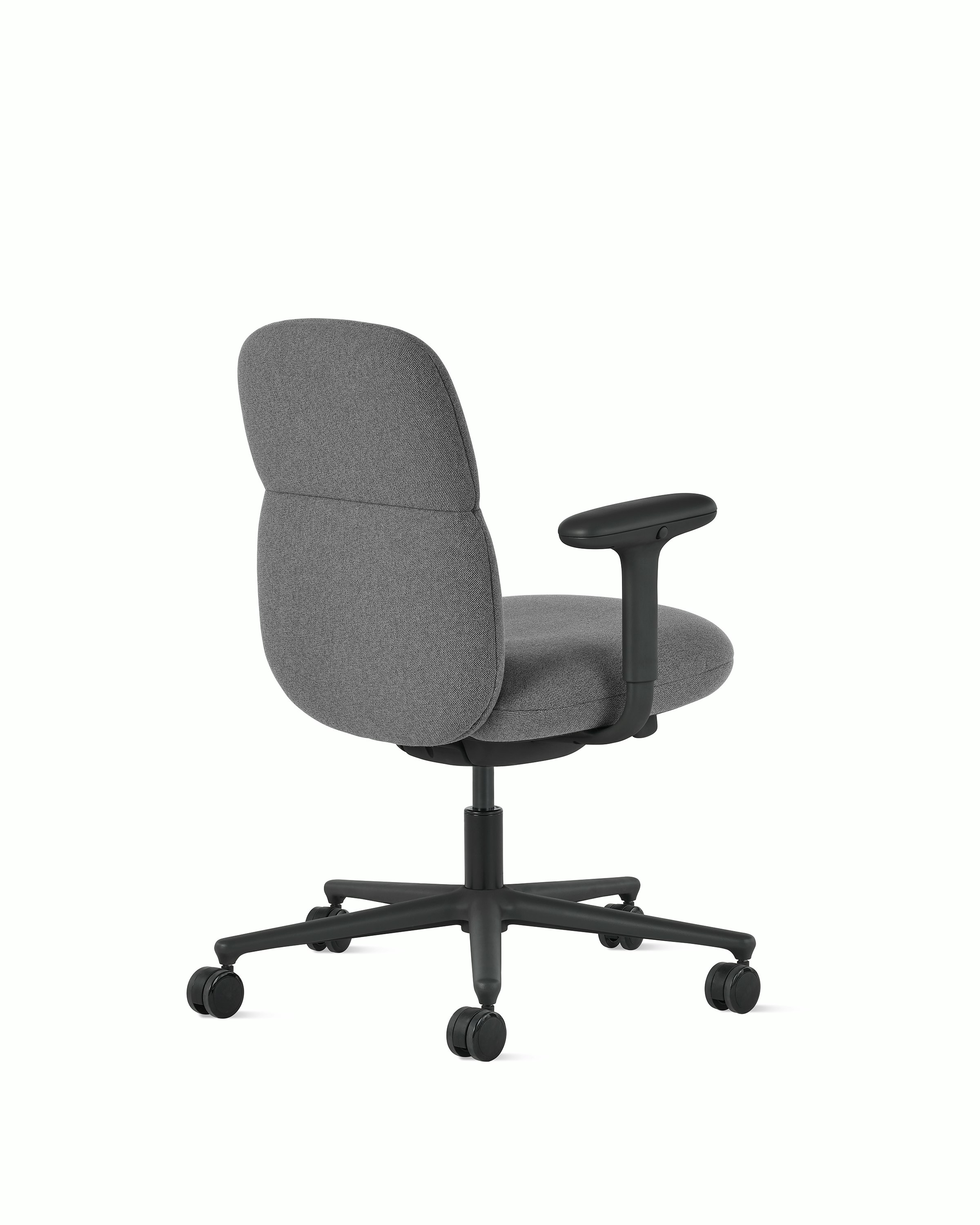 Rear angle view of a mid-back Asari chair by Herman Miller in dark grey with height adjustable arms.