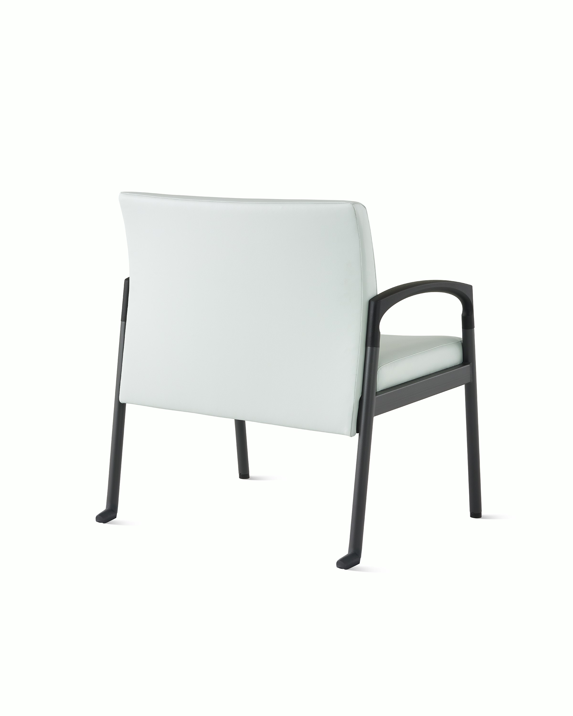 Three quarter back view of a Valor plus-size chair in a light gray upholstery and black frame on white sweep.