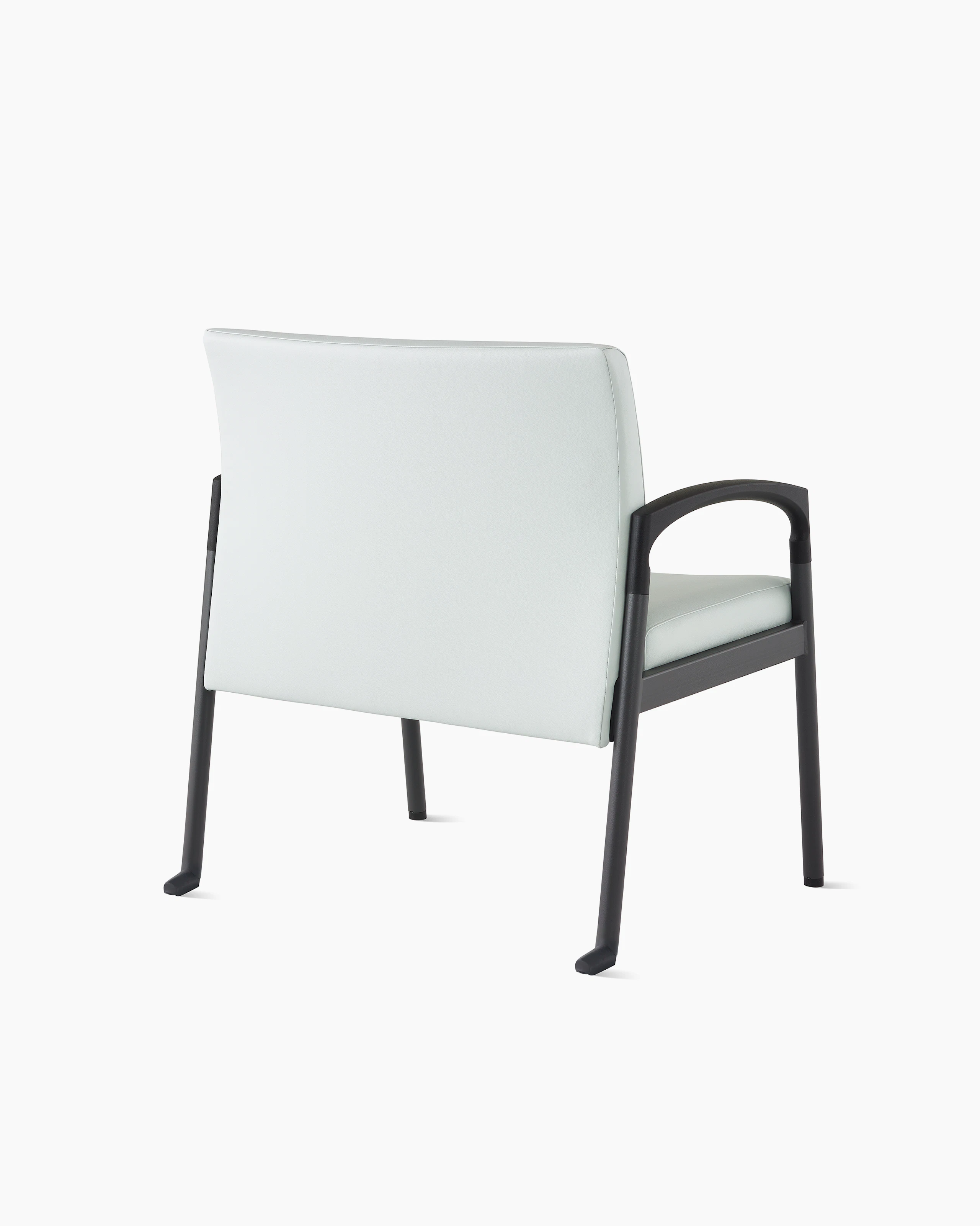 Three quarter back view of a Valor plus-size chair in a light gray upholstery and black frame on white sweep.