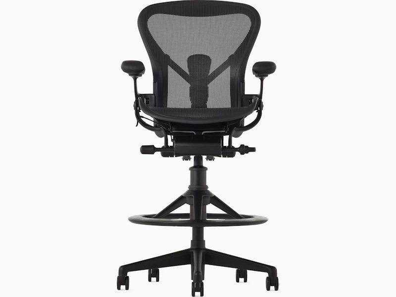 Black matte Aeron Stool on a white background, with a 5-star base and ergonomic back support, viewed from the front.