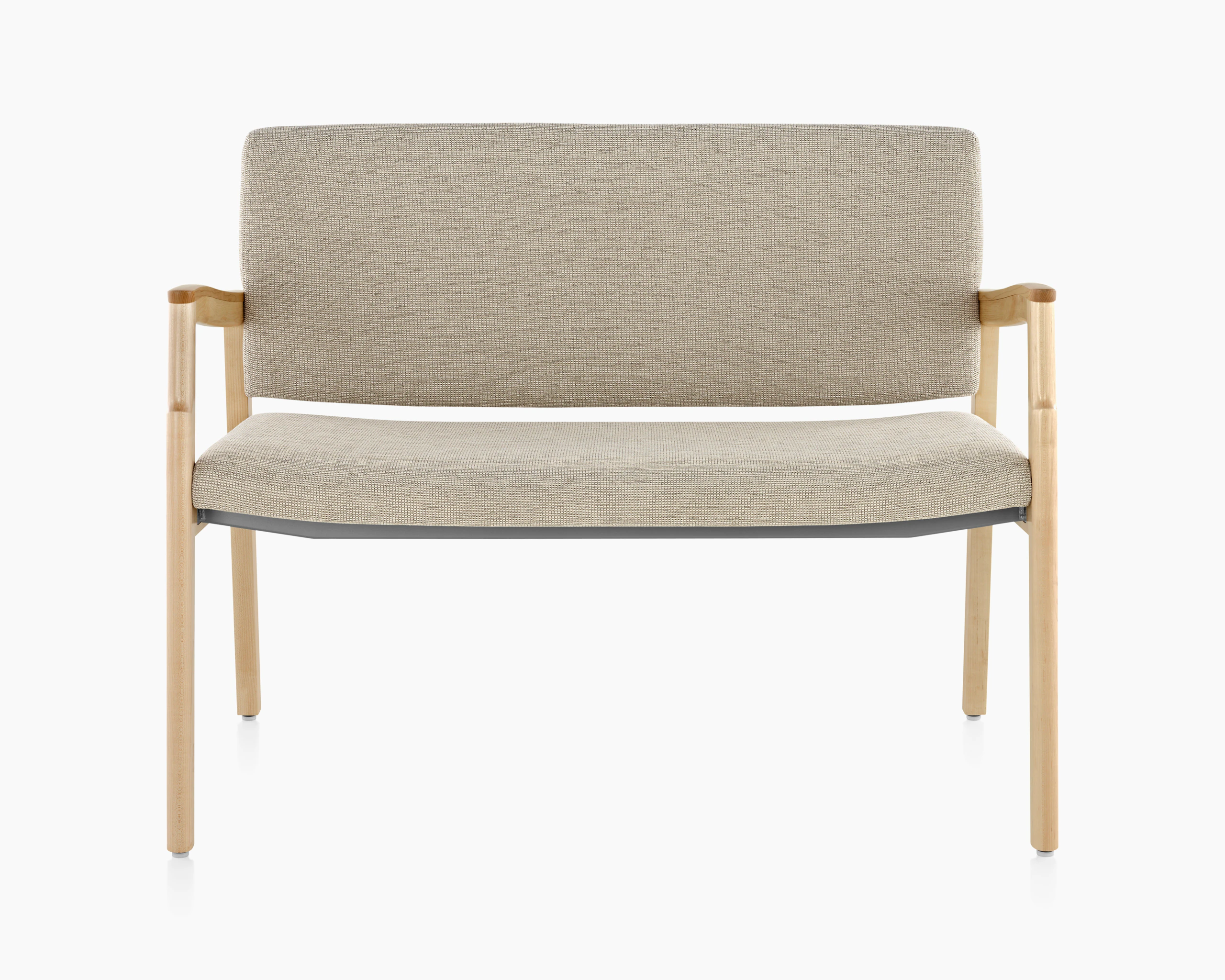 A Monarch Plus Chair in tan textile with solid hardwood frame and wood arm caps.