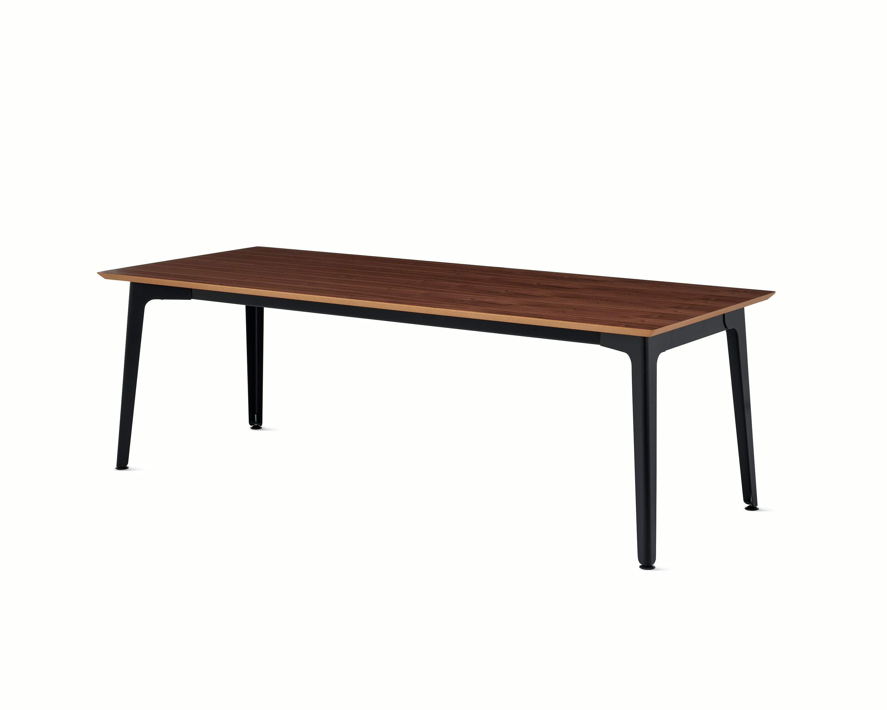 An angle of the Fold conference table with black steel base and walnut veneer top.
