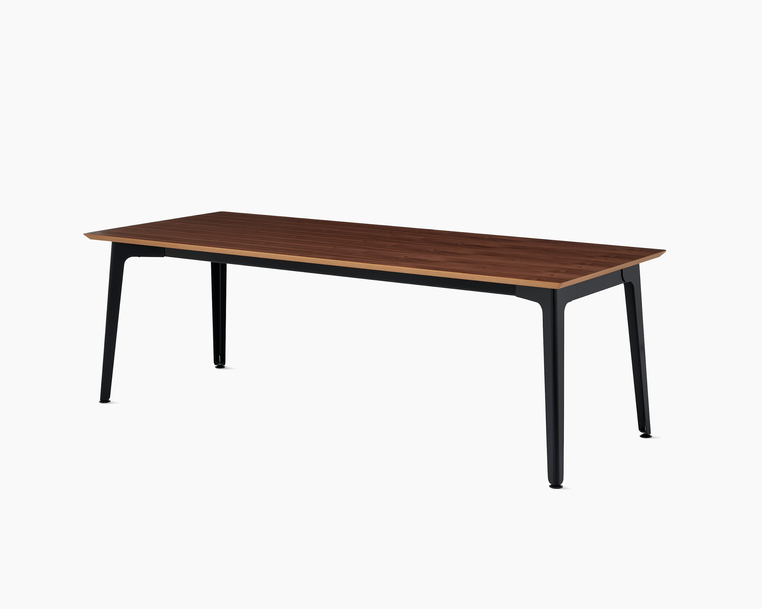 An angle of the Fold conference table with black steel base and walnut veneer top.