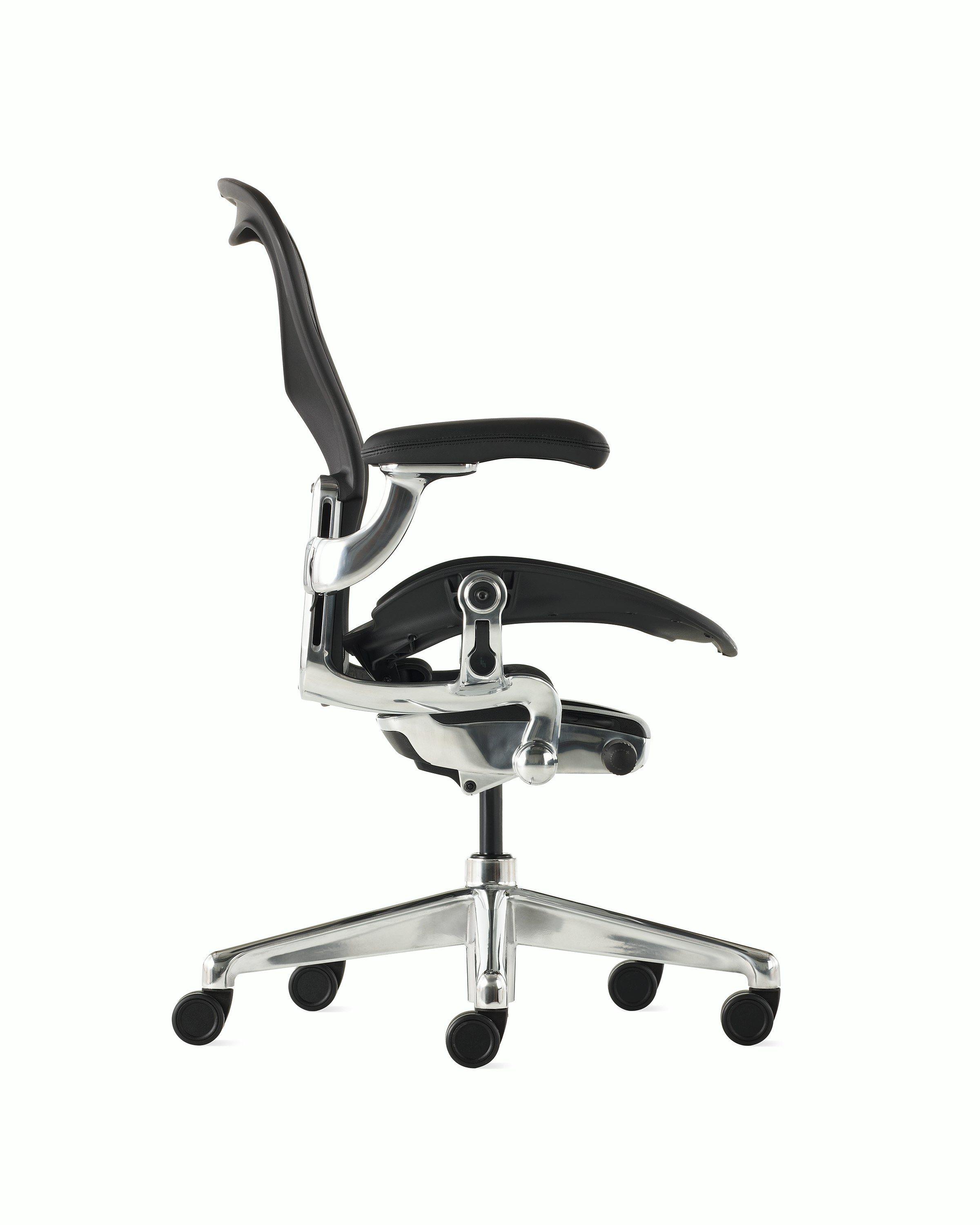 Black matte Aeron Chair on a white background with a polished aluminum 5-star base, chassis, and ergonomic back support, side view of chair.