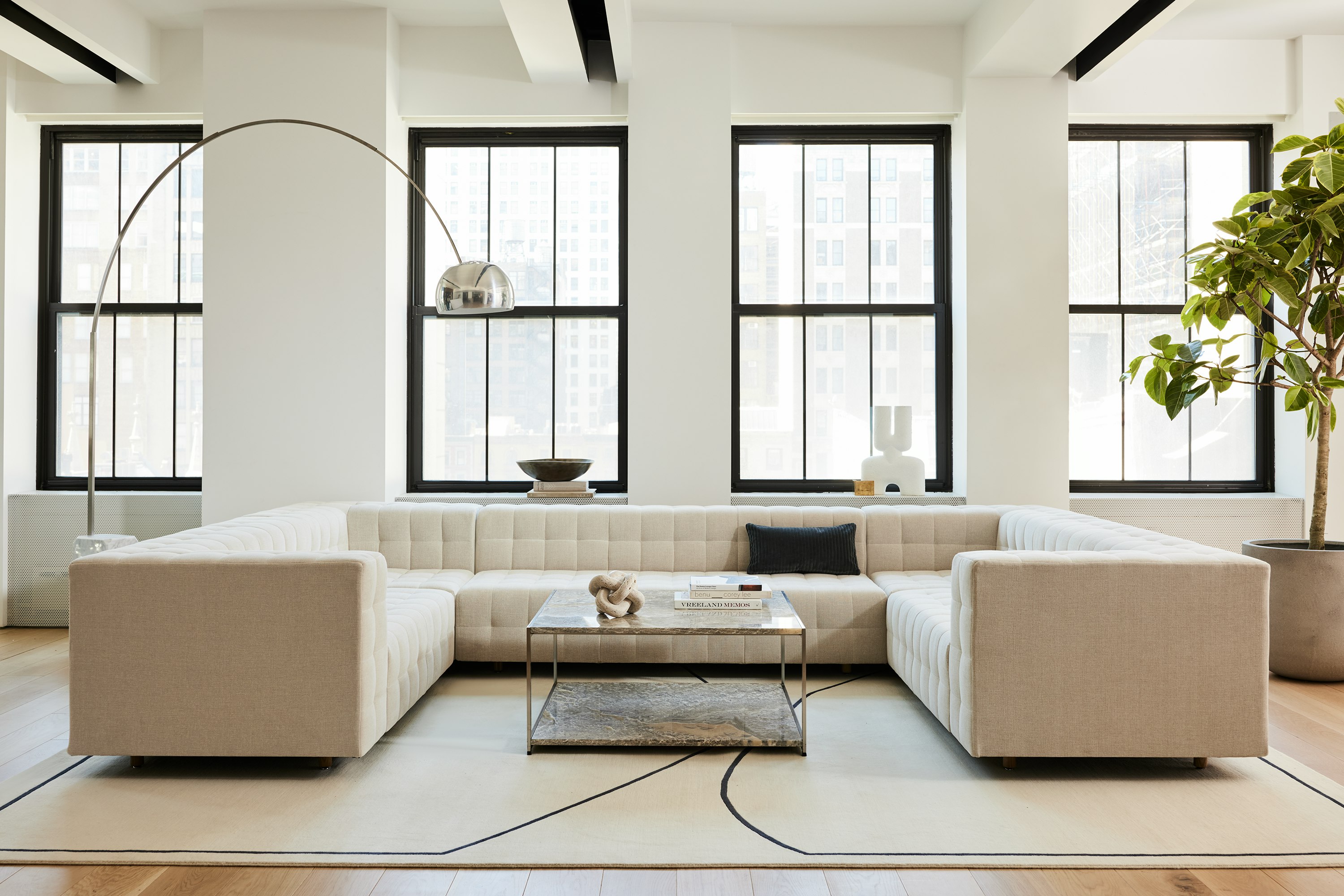 A contract lounge setting with U shaped Rapport Sofa and H Frame Coffee Table.