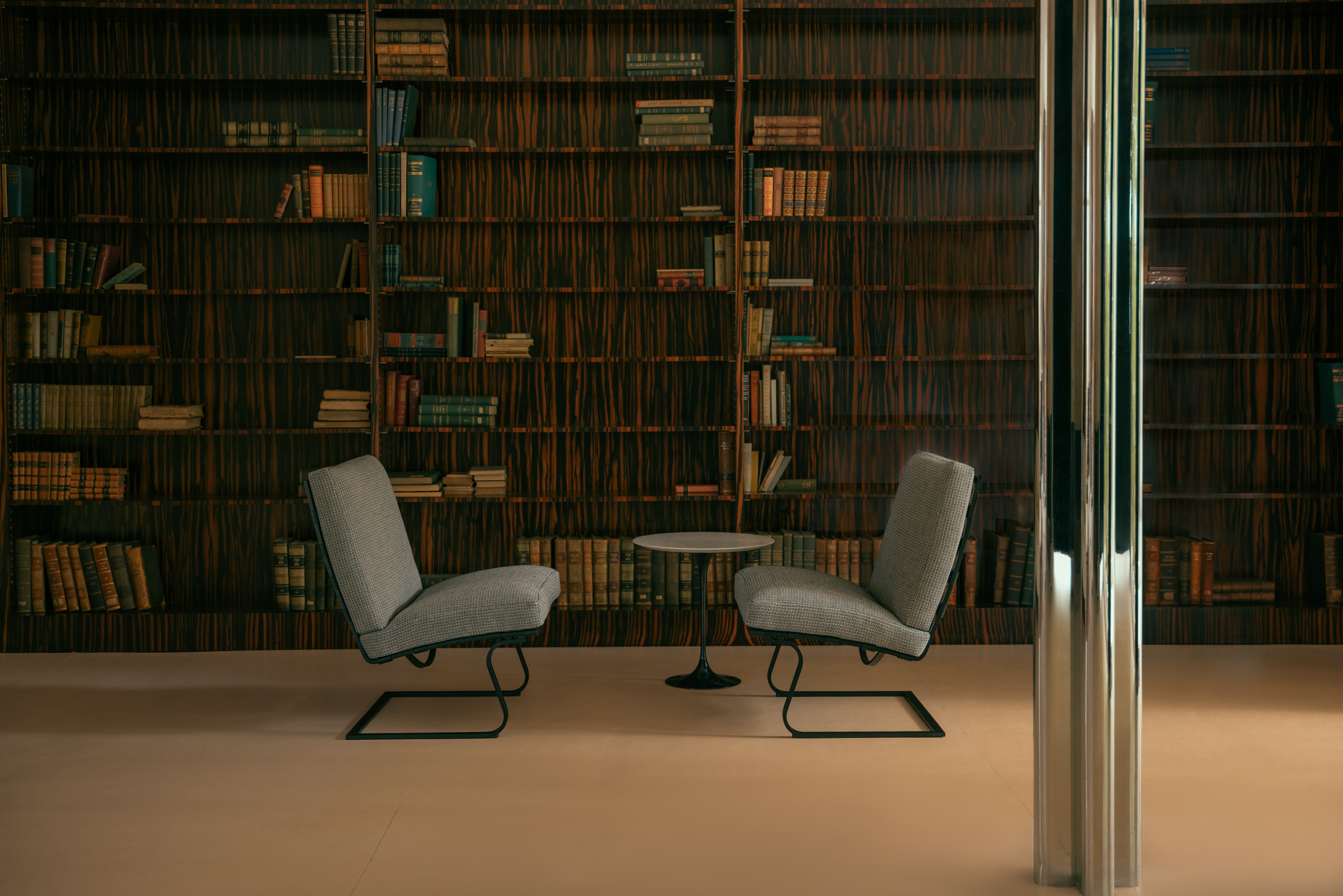 Tugendhat Chairs and Saarinen Side Table in the library