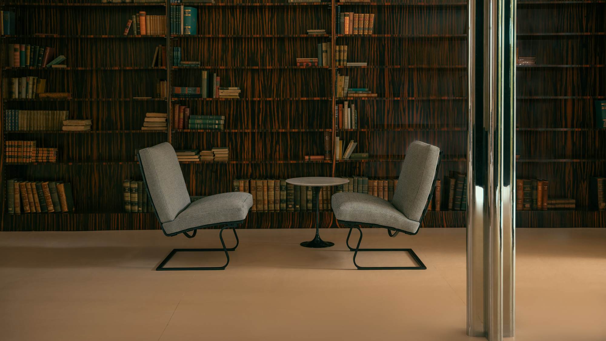 Tugendhat Chairs and Saarinen Side Table in the library