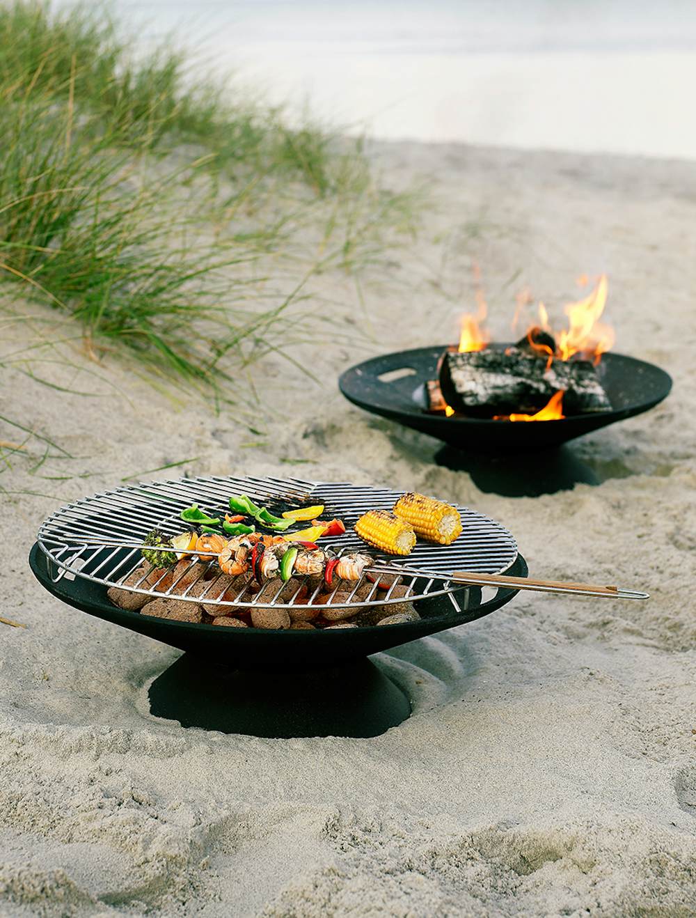 Cast-Iron Fire Bowls with Grates in a beachfront setting